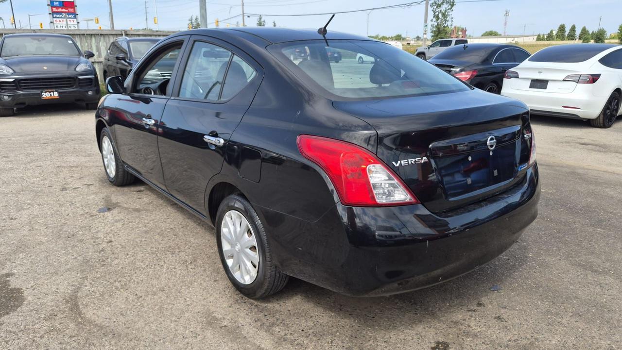 2012 Nissan Versa SV, MANUAL, SEDAN, GREAT ON FUEL, CERTIFIED Photo2