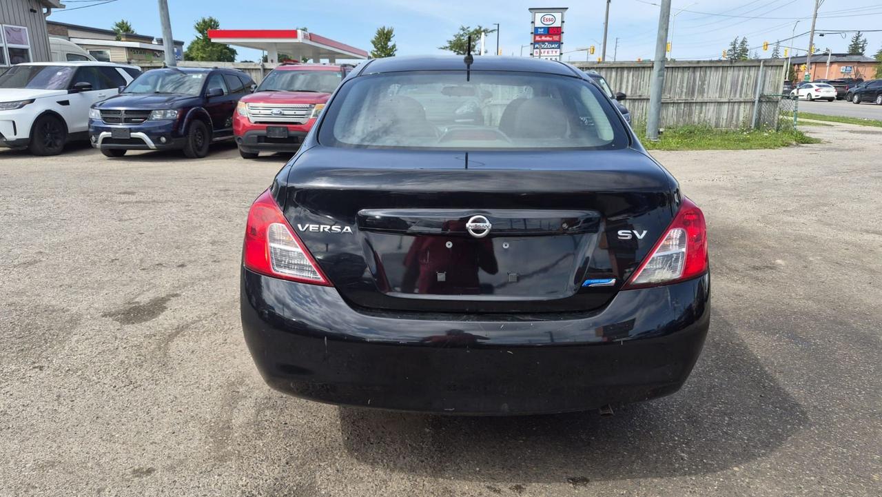 2012 Nissan Versa SV, MANUAL, SEDAN, GREAT ON FUEL, CERTIFIED Photo3