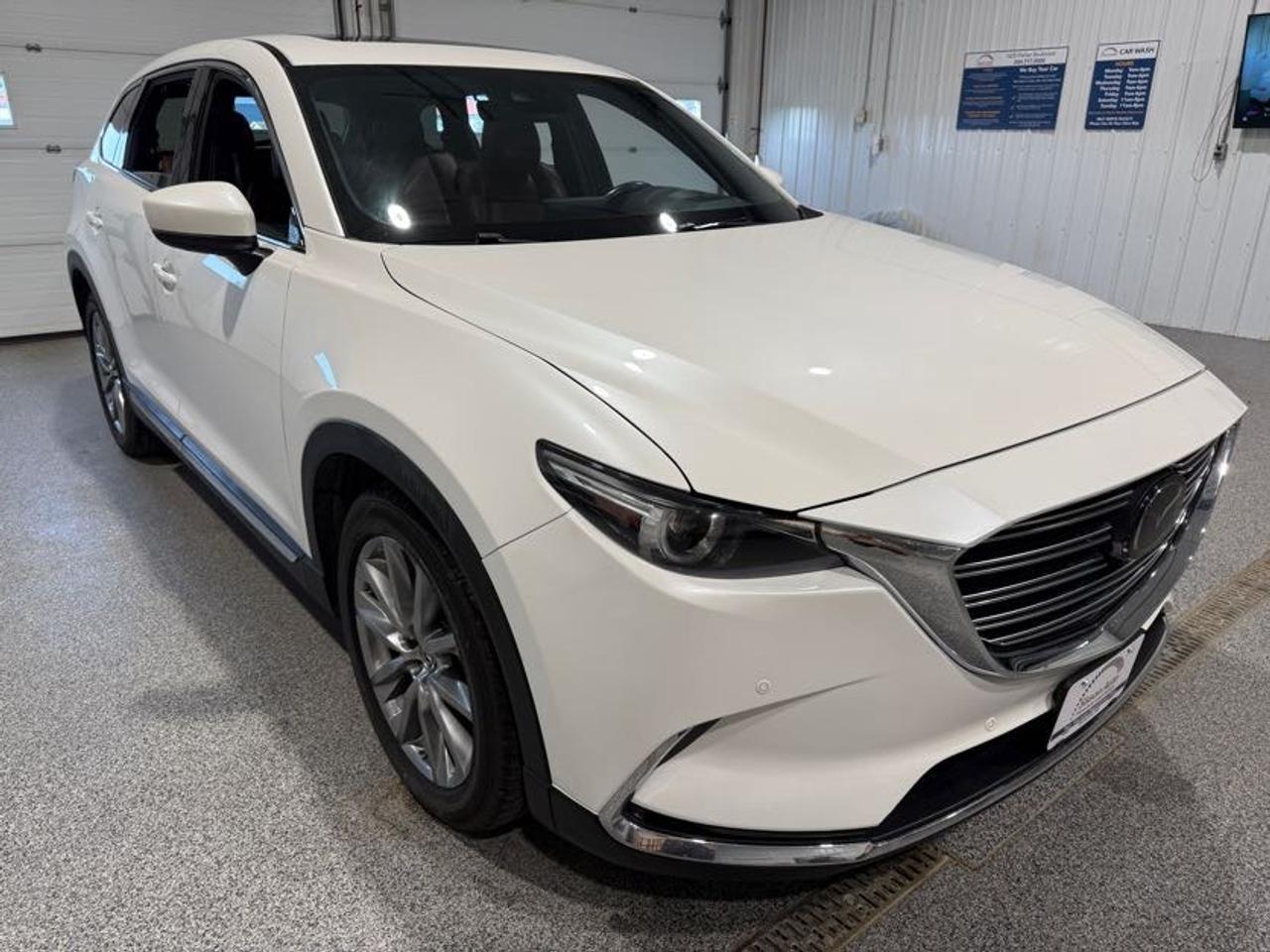 <p data-start=0 data-end=618>7-Passenger Luxury Meets Turbocharged All-Weather Capability</p><p data-start=0 data-end=618><br data-start=64 data-end=67> Experience upscale comfort, impressive performance, and year-round confidence with this 2019 Mazda CX-9 Signature AWD! Powered by a responsive 2.5L turbocharged engine paired with a smooth automatic transmission, this 7-passenger SUV delivers strong performance while providing the space and versatility needed for families and everyday adventures. The AWD system provides added traction and stability through changing road and weather conditions, making the CX-9 an excellent choice for daily commuting, road trips, and family adventures.<span aria-hidden=true></span></p><p data-start=620 data-end=1610>Step inside the Signature cabin and enjoy premium comfort throughout. With seating for up to 7 passengers, theres plenty of room for family and friends, while power-adjustable front seats with memory settings for the drivers seat, heated front and rear seats, and ventilated front seats provide exceptional comfort for everyone on board. A heated steering wheel and dual-zone climate control up front with separate rear climate controls ensure everyone can stay comfortable year-round. Push-button start and keyless entry add convenience, while Bluetooth, USB, and AUX connectivity keep you connected to your devices. Apple CarPlay and Android Auto are integrated through the touchscreen infotainment system, while built-in navigation helps guide your travels. The premium Bose sound system delivers an exceptional listening experience, and the sunroof adds natural light and fresh air to the cabin. A power liftgate makes loading and unloading cargo quick and easy.</p><p data-start=1612 data-end=2244>Advanced technology and driver assistance features help provide confidence on every journey. The 360-degree camera and backup camera make parking and maneuvering easier, while adaptive cruise control, lane keep assist, and forward collision warning provide added support on the road. Auto-dimming high beams and rain-sensing wipers further enhance convenience, especially during changing driving conditions. Refined, spacious, and packed with premium features, this 2019 Mazda CX-9 Signature AWD is an excellent choice for drivers looking for luxury, technology, and all-weather capability in a versatile 7-passenger SUV.</p><p data-start=2246 data-end=2281>Includes two keys and block heater.</p><p data-start=2283 data-end=2733>At Sisson Auto, we make buying a vehicle a seamless and stress-free experience. Our transparent pricing eliminates haggling and eliminates any hidden fees. To give you peace of mind, we offer a 3-day/600 km No-Hassle Return Policy, a 30-day exchange privilege, minimum warranties with 24-hour roadside assistance, a check for safety recalls, and a complimentary CarFax history report. Plus, home delivery is free within 200 km. Dealer permit #5471.</p><p data-start=0 data-end=585> </p><p data-start=2735 data-end=2920 data-is-last-node= data-is-only-node=>** This description was written by AI based on information provided about the vehicle. AI can sometimes produce incorrect information. Please confirm all details with the dealership. **</p>