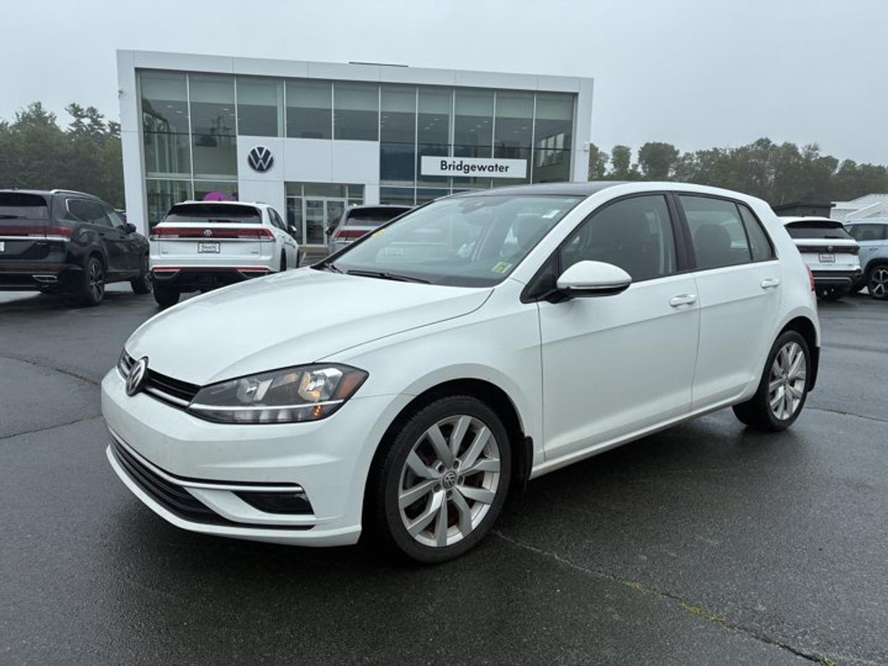 Recent Arrival! 2021 Volkswagen Golf HighlineApple CarPlay | Android Auto | Sirus XM Certified.This vehicle is a Volkswagen Certified Pre-Owned (CPO) model, meeting Volkswagen Canadas certification standards for quality, reliability, and performance. Volkswagen Certified Reconditioning Includes: Comprehensive Volkswagen multi-point inspection Reconditioning completed to Volkswagen Certified standards Verification of vehicle eligibility and service history Professional detailing and final inspection Volkswagen Certified Pre-Owned vehicles include manufacturer-backed benefits. Any concerns related to the certification process must be reviewed and addressed by the original selling dealer.CARFAX Canada No Reported AccidentsWhite FWD 8-Speed Automatic with Tiptronic 1.4L TSI Titan Black w/V-Tex Leatherette Seating Surfaces, 4-Wheel Disc Brakes, 6 Speakers, ABS brakes, Active Cruise Control, Air Conditioning, Alloy wheels, AM/FM radio: SiriusXM, App-Connect (Android Auto/Apple CarPlay/MirrorLink), Auto-dimming Rear-View mirror, Automatic temperature control, Brake assist, Bumpers: body-colour, Delay-off headlights, Driver door bin, Driver vanity mirror, Dual front impact airbags, Dual front side impact airbags, Electronic Stability Control, Exterior Parking Camera Rear, Four wheel independent suspension, Front anti-roll bar, Front Bucket Seats, Front dual zone A/C, Front reading lights, Fully automatic headlights, Heated door mirrors, Heated Front Comfort Seats, Heated front seats, Illuminated entry, Leather Shift Knob, Leather steering wheel, Leatherette Seating Surfaces, Low tire pressure warning, Navigation System, Occupant sensing airbag, Outside temperature display, Overhead airbag, Overhead console, Panic alarm, Passenger door bin, Passenger vanity mirror, Power door mirrors, Power driver seat, Power moonroof, Power passenger seat, Power steering, Power windows, Radio data system, Radio: MIBIII 8.0 Touchscreen Infotainment System, Rain sensing wipers, Rear anti-roll bar, Rear reading lights, Rear window defroster, Rear window wiper, Remote keyless entry, Security system, Speed-sensing steering, Speed-Sensitive Wipers, Split folding rear seat, Spoiler, Steering wheel mounted audio controls, Tachometer, Telescoping steering wheel, Tilt steering wheel, Traction control, Trip computer, Turn signal indicator mirrors, Variably intermittent wipers, Wheels: 7J x 17 Icona Alloy.