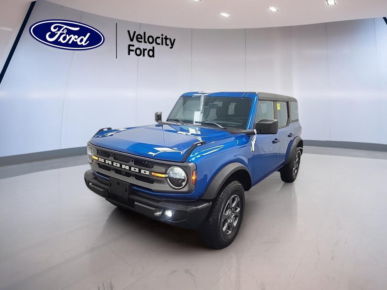 // ACCIDENT FREE!! //
// SINGLE OWNER! //

Meet the 2024 Ford Bronco Big Bend 4 Door 4x4 at Velocity Ford in Moose Jaw. This used SUV has had one owner and CARFAX Canada reports no accidents. With 35,414 km, a blue exterior, black interior, and a 2.3-litre unleaded engine, this Bronco Big Bend 4 Door 4x4 is ready for daily driving and weekend trails.

The 2024 Ford Bronco Big Bend 4 Door 4x4 blends open-air fun, true 4WD ability, and smart everyday comfort. Its automatic transmission helps make city trips easy, while the off-road tires, rear tow hook, and durable design support adventure when the pavement ends.

FEATURES OF THE Bronco Big Bend 4 Door 4x4

»» Removable roof adds open-air driving fun
»» Four-door layout improves passenger access
»» Off-road tires support trail-ready capability
»» Rear tow hook adds useful recovery help

ADVANCED SAFETY FEATURES

»» Anti-lock braking system helps maintain control
»» Stability control supports confident road handling
»» Backup camera helps with reversing visibility
»» Side and head airbags add protection

PERFORMANCE AND EFFICIENCY

»» 2.3-litre engine delivers solid turbocharged performance
»» Automatic transmission supports smooth daily driving
»» Four-wheel drive boosts traction off-road
»» Power steering helps easy low-speed manoeuvres

COMFORT AND CONVENIENCE

»» Cruise control adds ease on highways
»» Front air conditioning keeps cabin comfortable
»» Power windows add everyday convenience
»» Adjustable steering wheel improves driving position

TECHNOLOGY AND CONNECTIVITY

»» Bluetooth integration supports hands-free phone use
»» WiFi hotspot helps keep devices connected
»» Satellite radio expands in-cabin entertainment choices
»» Steering wheel audio controls reduce distraction

CARGO SPACE

»» Rear trunk access simplifies loading gear
»» Four-door design helps pack passenger items
»» Spare tire adds peace of mind
»» Versatile SUV layout suits active lifestyles

AWARDS & RECOGNITIONS

»» Best Off-Road SUV, The Car Guide, 2024

WHAT OTHER OWNERS LIKE

»» Removable roof and fun open-air feel
»» Strong off-road ability with true 4WD
»» Easy-to-use tech and clear controls
»» Comfortable ride with practical everyday use

This Bronco Big Bend 4 Door 4x4 also includes heated mirrors, electric mirrors, tinted windows, automatic headlights, fog lights, LED headlamps, push button start, child safety locks, automatic door locks, tire pressure monitoring, a leather steering wheel, illuminated driver and passenger vanity mirrors, passenger airbag sensor, and a convertible design that adds extra freedom.

Finished in blue with a black interior, this 2024 Ford Bronco Big Bend 4 Door 4x4 offers a bold look and useful features without overcomplicating the drive. If you want a capable SUV with proven ownership history, modern essentials, and real character, this Ford is a great fit for life in Saskatchewan.

This 2024 Ford Bronco Big Bend 4 Door 4x4s VIN is: 1FMDE7BH0RLA80096.