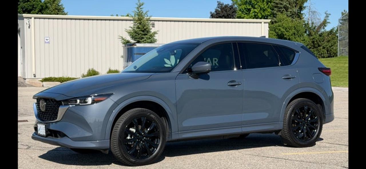 Come see this certified 2025 Mazda CX-5 GT AWD | Leather | Sunroof | Heated + Ventilated Seats | Heated Steering | Bose Audio | and More !. Its Automatic transmission and 2.5 L engine will keep you going. This Mazda CX-5 comes equipped with these options: Sunroof, Leather, Heated Steering Wheel, Bose Speaker System, Apple Car Play, Air Conditioning, Adaptive Cruise, Heated Seats, Tilt Steering Wheel, and Steering Radio Controls. Stop by and visit us at Mark Wilsons Better Used Cars, 5055 Whitelaw Road, Guelph, ON N1H 6J4.MASSIVE SELECTION: 500+ vehicles in ONE LOCATION, all Live Market Priced for the best value!STRAIGHTFORWARD & TRANSPARENT PRICING: Our Advertised Price INCLUDES:Safety Certification! (No separate certification fee upcharge).FREE Carfax History Report!NO upcharge for paying cash!CONFIDENCE & PEACE OF MIND: 30-Day/3,000 km Warranty INCLUDED! Plus a 5-Day Exchange Privilege!*EASY FINANCING: Better-than-bank rates, $0 Down, and 3 Months No Payments available OAC. BAD CREDIT APPROVED HERE!WE BUY CARS: Get Top Dollar for your trade, or sell us your vehicle for CASH even if you dont buy ours!www.shopwilsons.comAn Honest, Transparent Buying Experience. Trusted in business since 1961!(Cash Prices Exclude HST and Licensing Fees only.)