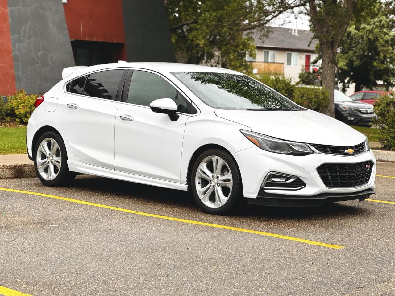 2018 Chevrolet Cruze Hatchback Premier - Turbo | Leather | Heated Seats | Apple CarPlay | For Sale in Saskatoon, SK

VIN: 3G1BF6SM0JS585725
Mileage: 131,216 KM
Exterior Color: White
Interior: Premium Black Leather
Trim: Premier Hatchback
Drivetrain: Front-Wheel Drive
Engine: 1.4L Turbocharged 4-Cylinder
Transmission: 6-Speed Automatic

2018 Chevrolet Cruze Hatchback Premier for Sale in Saskatoon, Saskatchewan

Looking for a 2018 Chevrolet Cruze Hatchback Premier for sale in Saskatoon? This well-equipped compact hatchback combines excellent fuel economy, turbocharged performance, premium comfort, modern smartphone connectivity, and the added practicality of a versatile hatchback design.

Finished in White with a Premium Black Leather Interior, this 2018 Chevrolet Cruze Premier has 131,216 KM and is an excellent choice for commuters, students, first-time buyers, small families, or anyone looking for an affordable and fuel-efficient used car in Saskatchewan.

Under the hood is Chevrolets 1.4L turbocharged 4-cylinder engine, producing approximately 153 horsepower and 177 lb-ft of torque. Paired with a smooth 6-speed automatic transmission, the Cruze delivers responsive everyday performance while maintaining excellent fuel economy.

Available now at Platinum Auto Sport in Saskatoon, this Cruze Premier Hatchback offers premium features and impressive cargo versatility in an affordable compact package.

1.4L Turbocharged Performance & Fuel Economy

The Cruzes turbocharged engine provides a strong balance between everyday performance and efficiency.

Performance Features
1.4L DOHC Turbocharged 4-Cylinder Engine
Approximately 153 Horsepower
Approximately 177 lb-ft of Torque
6-Speed Automatic Transmission
Front-Wheel Drive
Electric Power Steering
MacPherson Strut Front Suspension
StabiliTrak® Electronic Stability Control
Traction Control
Four-Wheel Anti-Lock Brakes
Excellent Highway Fuel Economy
Responsive Turbocharged Acceleration
Smooth Highway Driving Characteristics

For Saskatchewan drivers who put on significant kilometres, the Cruze is an excellent option for keeping everyday fuel and ownership costs manageable.

Premier Trim - Premium Comfort

The Premier sits at the top of the Cruze trim lineup and adds desirable comfort, appearance, and convenience equipment.

Premier Interior & Comfort Features
Premium Black Leather Seating
Heated Front Seats
Heated Leather-Wrapped Steering Wheel
Power Driver Seat
Driver Power Lumbar Adjustment
Automatic Climate Control
Remote Engine Start
Chevrolet Keyless Open
Push Button Start
Cruise Control
Power Windows
Power Door Locks
Leather-Wrapped Steering Wheel
Tilt & Telescopic Steering Column
Front Centre Armrest
Rear Centre Armrest
60/40 Split Folding Rear Seats
Premium Interior Trim
Chevrolet MyLink® Technology

The Cruze Premier provides modern smartphone integration and easy-to-use infotainment technology.

Technology & Connectivity
Chevrolet MyLink® Infotainment System
7-Inch Colour Touchscreen
Apple CarPlay®
Android Auto
Bluetooth® Hands-Free Calling
Bluetooth® Audio Streaming
SiriusXM® Satellite Radio Capability
USB Connectivity
Auxiliary Audio Input
Steering Wheel Mounted Audio Controls
Voice Recognition
Rear Vision Camera
Driver Information Centre
OnStar® Capability
4G LTE Wi-Fi Hotspot Capability
Hatchback Cargo Versatility

Unlike the conventional Cruze sedan, the Cruze Hatchback provides significantly greater flexibility for carrying larger items.

Hatchback Practicality
Five-Door Hatchback Design
Spacious Rear Cargo Area
Wide-Opening Rear Liftgate
60/40 Split Folding Rear Seats
Expandable Cargo Capacity
Seating for Five Passengers
Excellent Rear Passenger Space
Multiple Interior Storage Compartments
Front & Rear Cupholders
Compact Exterior Dimensions for Easy Parking

Fold the rear seats down and the Cruze transforms from an efficient commuter into a surprisingly versatile cargo hauler.

Safety & Driver Confidence
Safety Features
Rear Vision Backup Camera
StabiliTrak® Electronic Stability Control
Traction Control
Four-Wheel Anti-Lock Braking System
Brake Assist
Tire Pressure Monitoring System
Advanced Airbag System
Front Airbags
Side-Impact Airbags
Side Curtain Airbags
LATCH Child Seat Anchors
Rear Child Safety Locks
Teen Driver Technology
OnStar® Emergency Services Capability

Additional driver-assistance features may be present depending on the vehicles original factory option packages.

Exterior Features
Exterior Highlights
White Exterior
Premier Exterior Styling
17-Inch Aluminum Wheels
LED Daytime Running Lights
Automatic Headlights
Fog Lamps
Heated Power Exterior Mirrors
Body-Coloured Exterior Mirrors
Chrome Exterior Accents
Rear Roof Spoiler
Rear Window Wiper
Five-Door Hatchback Body
Remote Keyless Entry
Premium Black Leather Interior

The Premier trim gives this Cruze a more upscale cabin than the typical economy-oriented compact car.

Interior Highlights
Premium Black Leather Interior
Heated Front Seats
Heated Steering Wheel
Power Driver Seat
Automatic Climate Control
Leather-Wrapped Steering Wheel
Push Button Start
Remote Start
Five-Passenger Seating
Split Folding Rear Seats
Flexible Hatchback Cargo Area
Smartphone Connectivity
Comfortable Highway Cabin
Why Buy This 2018 Chevrolet Cruze Hatchback Premier?
Desirable Premier Trim
Practical 5-Door Hatchback
1.4L Turbocharged Engine
6-Speed Automatic Transmission
Excellent Fuel Economy
Premium Black Leather Interior
Heated Front Seats
Heated Steering Wheel
Power Driver Seat
Remote Engine Start
Push Button Start
Apple CarPlay®
Android Auto
Bluetooth®
Rearview Backup Camera
17-Inch Alloy Wheels
Flexible Fold-Down Rear Seating
Excellent Cargo Versatility
Affordable Daily Commuter
Great First Vehicle
Excellent Value for Saskatchewan Drivers
In-House Financing at Platinum Auto Sport Saskatoon

At Platinum Auto Sport in Saskatoon, we specialize in helping customers find automotive financing solutions for a wide range of credit situations.

Our finance team works with multiple Canadian banks and automotive lenders to help find financing options based on each customers individual circumstances, income, credit profile, vehicle selection, and budget.

Financing Options for All Types of Credit
Excellent Credit
Good Credit
Bad Credit
No Credit
Credit Rebuilding
First-Time Buyers
New to Canada
Self-Employed Customers
Previous Bankruptcy
Consumer Proposal
Trade-Ins Welcome

Whether youre searching for Chevrolet Cruze financing in Saskatoon, bad credit car financing in Saskatchewan, used car loans in Saskatoon, first-time buyer financing, new-to-Canada vehicle financing, or an affordable fuel-efficient vehicle with flexible payment options, Platinum Auto Sport can help you explore available solutions.

Serving Used Car Buyers Across Saskatchewan

Platinum Auto Sport proudly serves customers throughout Saskatoon, Regina, Prince Albert, Moose Jaw, North Battleford, Yorkton, Swift Current, Weyburn, Estevan, Warman, Martensville, and communities across Saskatchewan.

If youre searching for a used Chevrolet Cruze in Saskatoon, 2018 Chevrolet Cruze Premier for sale in Saskatchewan, used hatchback for sale, fuel-efficient used car, or an affordable vehicle with financing options, this Cruze deserves a closer look.

Why Buy From Platinum Auto Sport?

Platinum Auto Sport is a Saskatoon used vehicle dealership specializing in quality pre-owned cars, SUVs, trucks, luxury vehicles, and performance vehicles.

We offer:

Financing Options for All Types of Credit
Multiple Lending Partners
Competitive Trade-In Values
Extended Warranty Options Available
Professionally Inspected Vehicles
Vehicle Delivery Options
Trade-Ins Welcome
Straightforward, No-Pressure Buying Experience
Quality Pre-Owned Inventory
Book Your Test Drive Today

This 2018 Chevrolet Cruze Hatchback Premier combines turbocharged fuel efficiency with the comfort of premium leather, heated seats, a heated steering wheel, smartphone connectivity, and the everyday versatility of a five-door hatchback.

With 131,216 KM, a clean White exterior, and Premium Black Leather Interior, this Cruze Premier is an excellent option for Saskatchewan buyers looking for an affordable, well-equipped, and fuel-efficient used car.

Visit Platinum Auto Sport at 330 22nd Street West in Saskatoon, Saskatchewan, or apply online today to explore your financing options.

Platinum Auto Sport - Saskatoons destination for quality pre-owned Chevrolet vehicles, affordable used cars, fuel-efficient hatchbacks, trade-ins, and financing solutions for all types of credit across Saskatchewan.
