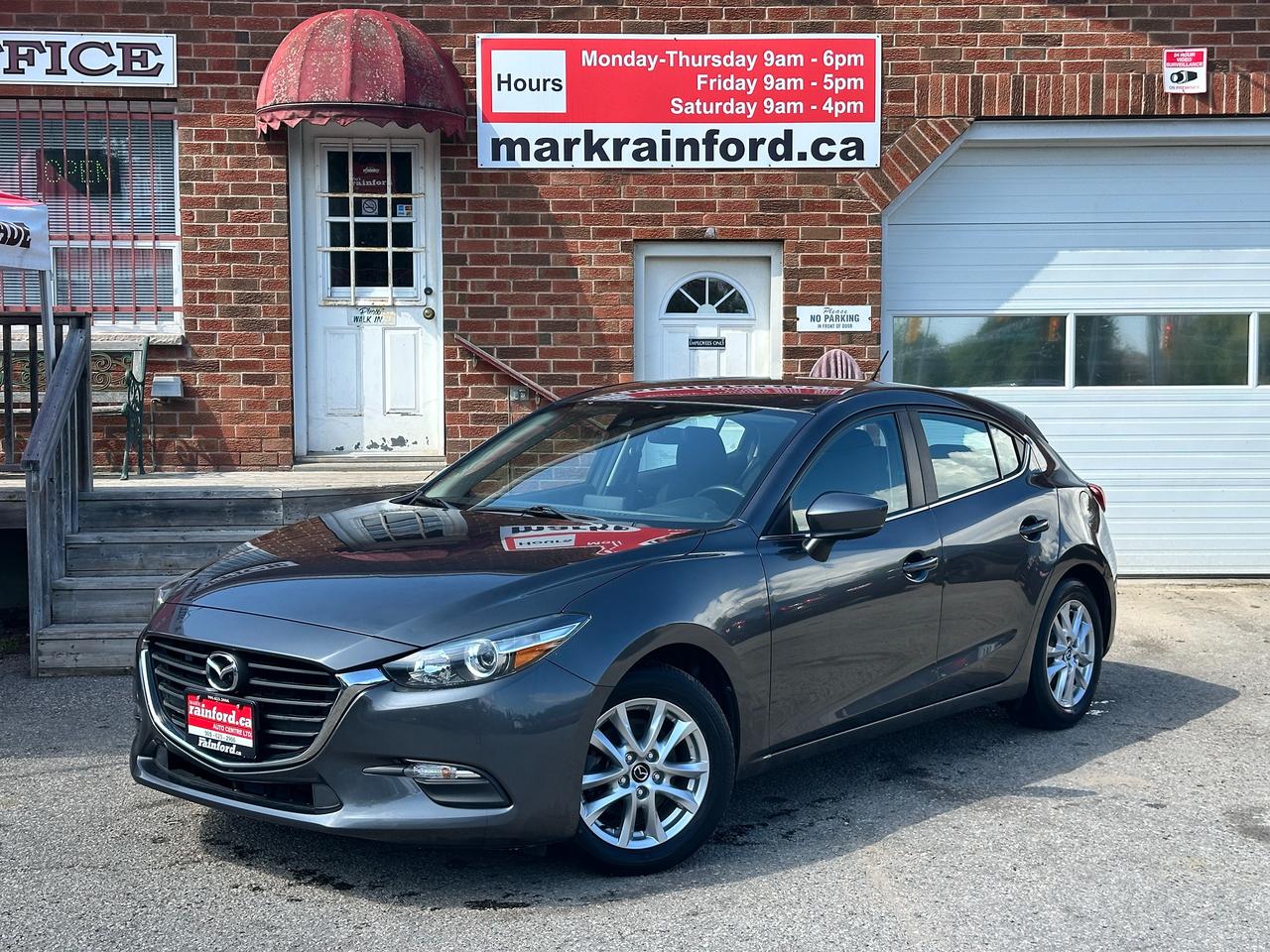 <p>Clean and Comfortable Mazda MAZDA3 from Keswick, ON! This GS Auto Hatchback model looks sharp in its Grey paint and factory alloy wheels, with nice options and great fuel economy! The exterior features keyless entry, automatic headlights, colour-matched side mirrors with integrated turn signals, a sleek rear spoiler, sporty dual-exit rear exhaust, a small trailer hitch perfect for mounting a bike rack, gorgeous split-spoke factory alloy wheels, a peppy and fuel-efficient 2.0L 4-Cylinder Engine and Automatic transmission! The interior is clean and comfortable with heated cloth front seats, power door locks, windows and mirrors, comfortable rear seating and a large cargo area, a heated leather-wrapped steering wheel with Audio and Cruise controls, an easy-to-read and use gauge cluster, push-button start, a central AM/FM HD Radio with Bluetooth, MP3, Compass and Backup Camera, A/C climate controls with front and rear window defrost settings, Sport Driving mode, USB/SD/12V accessory ports and more!</p><p>&nbsp;</p><p>Carfax Claims Free, Sharp-Styling, Good Fuel Economy and Easy to Park!</p><p><strong>Our price includes safety certification, NO ADMIN FEES!</strong></p><p>Call (905) 623-2906</p><p>&nbsp;</p><p>Text Ryan: (905) 429-9680 or email: ryan@markrainford.ca</p><p>&nbsp;</p><p>Text Mark: (905) 431-0966 or email: mark@markrainford.ca</p>