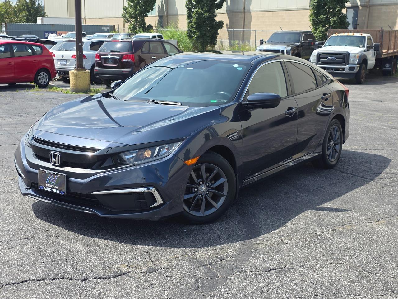 <p dir=ltr>JUST ARRIVED!!</p><p dir=ltr>2020 Honda Civic EX</p><p dir=ltr>GREAT BACK TO SCHOOL CAR!!</p><p dir=ltr>2020 Honda Civic EX with the 2.0-liter engine is a front-wheel-drive compact car featuring a 158-horsepower 4-cylinder engine and a smooth continuously variable transmission (CVT). It achieves an estimated combined fuel economy of roughly 7.1 L/100 km (33 MPG combined) and comes well-equipped with modern safety and tech features.</p><p dir=ltr><strong>Engine and Performance:</strong></p><p dir=ltr><strong>Engine: </strong>2.0-liter naturally aspirated 4-cylinder.</p><p dir=ltr><strong>Power: </strong>158 hp at 6,500 rpmTorque: 138 lb-ft at 4,200 rpm.</p><p dir=ltr><strong>Transmission: </strong>Continuously Variable Transmission (CVT).</p><p dir=ltr><strong>Drivetrain: </strong>Front-wheel drive (FWD).</p><p dir=ltr><strong>Key Features:</strong></p><p dir=ltr><strong>Safety: </strong>Honda Sensing suite (adaptive cruise control, lane keeping assist, and collision mitigation braking).</p><p dir=ltr><strong>Interior:</strong> Heated front seats, automatic climate control, and a power-adjustable drivers seat.</p><p dir=ltr><strong>Technology:</strong> 7-inch touchscreen with Apple CarPlay and Android Auto integration.</p><p dir=ltr><strong>Exterior:</strong> Alloy wheels and LED daytime running lights.</p><p dir=ltr style=line-height: 1.2; margin-top: 12pt; margin-bottom: 12pt;>&nbsp;</p><p dir=ltr style=line-height: 1.2; margin-top: 12pt; margin-bottom: 12pt;><span style=font-size: 11pt; font-family: Roboto,sans-serif; color: #000000; background-color: transparent; font-weight: 400; font-style: italic; font-variant: normal; text-decoration: none; vertical-align: baseline; white-space: pre-wrap;>**VEHICLE BEING SOLD ON CONSIGNMENT** </span></p><p dir=ltr style=line-height: 1.2; margin-top: 12pt; margin-bottom: 12pt;><span style=font-size: 11pt; font-family: Roboto,sans-serif; color: #000000; background-color: transparent; font-weight: 400; font-style: italic; font-variant: normal; text-decoration: none; vertical-align: baseline; white-space: pre-wrap;>FINANCING AND LEASING AVAILABLE ON ALL CERTIFIED VEHICLES.</span></p><p dir=ltr style=line-height: 1.2; margin-top: 12pt; margin-bottom: 12pt;><span style=font-size: 11pt; font-family: Roboto,sans-serif; color: #000000; background-color: transparent; font-weight: 400; font-style: italic; font-variant: normal; text-decoration: none; vertical-align: baseline; white-space: pre-wrap;>HST and Licensing Fees are to be charged on all vehicles.&nbsp;</span></p><p dir=ltr style=line-height: 1.2; margin-top: 12pt; margin-bottom: 12pt;><span style=font-size: 11pt; font-family: Roboto,sans-serif; color: #000000; background-color: transparent; font-weight: 400; font-style: italic; font-variant: normal; text-decoration: none; vertical-align: baseline; white-space: pre-wrap;>All CERTIFIED vehicles come with a 36-day Safety Guarantee.</span></p><p dir=ltr style=line-height: 1.2; margin-top: 12pt; margin-bottom: 12pt;><span style=font-size: 11pt; font-family: Roboto,sans-serif; color: #000000; background-color: transparent; font-weight: 400; font-style: italic; font-variant: normal; text-decoration: none; vertical-align: baseline; white-space: pre-wrap;>ALL CERTIFIED VEHICLES COME WITH A BRONZE GLOBAL WARRANTY (3 MONTH / 3,000 KM / $1,000 PER CLAIM)</span></p><p dir=ltr style=line-height: 1.2; margin-top: 12pt; margin-bottom: 12pt;><span style=font-size: 11pt; font-family: Roboto,sans-serif; color: #000000; background-color: transparent; font-weight: 400; font-style: italic; font-variant: normal; text-decoration: none; vertical-align: baseline; white-space: pre-wrap;>EXTENDED GLOBAL WARRANTY OPTIONS AVAILABLE ON ALL CERTIFIED VEHICLES.</span></p><p dir=ltr style=line-height: 1.2; margin-top: 12pt; margin-bottom: 12pt;><span style=font-size: 11pt; font-family: Roboto,sans-serif; color: #000000; background-color: transparent; font-weight: 400; font-style: italic; font-variant: normal; text-decoration: none; vertical-align: baseline; white-space: pre-wrap;>Auto View is located at 590 South Service Road Stoney Creek, only minutes off the QEW Exit 83 Fruitland Road!</span></p><p dir=ltr style=line-height: 1.2; margin-top: 12pt; margin-bottom: 12pt;><span style=font-size: 11pt; font-family: Roboto,sans-serif; color: #000000; background-color: transparent; font-weight: 400; font-style: italic; font-variant: normal; text-decoration: none; vertical-align: baseline; white-space: pre-wrap;>Contact us VIA email, call, or text!</span></p><p dir=ltr style=line-height: 1.2; margin-top: 12pt; margin-bottom: 12pt;><span style=font-size: 11pt; font-family: Roboto,sans-serif; color: #000000; background-color: transparent; font-weight: 400; font-style: italic; font-variant: normal; text-decoration: none; vertical-align: baseline; white-space: pre-wrap;>sales@autoview.ca</span></p><p style=line-height: 1.2;><span id=docs-internal-guid-dc6619b1-7fff-14fb-1847-6df547af7f68></span></p><p dir=ltr style=line-height: 1.2; margin-top: 12pt; margin-bottom: 12pt;><span style=font-size: 11pt; font-family: Roboto,sans-serif; color: #000000; background-color: transparent; font-weight: 400; font-style: italic; font-variant: normal; text-decoration: none; vertical-align: baseline; white-space: pre-wrap;>905-379-4206</span></p>