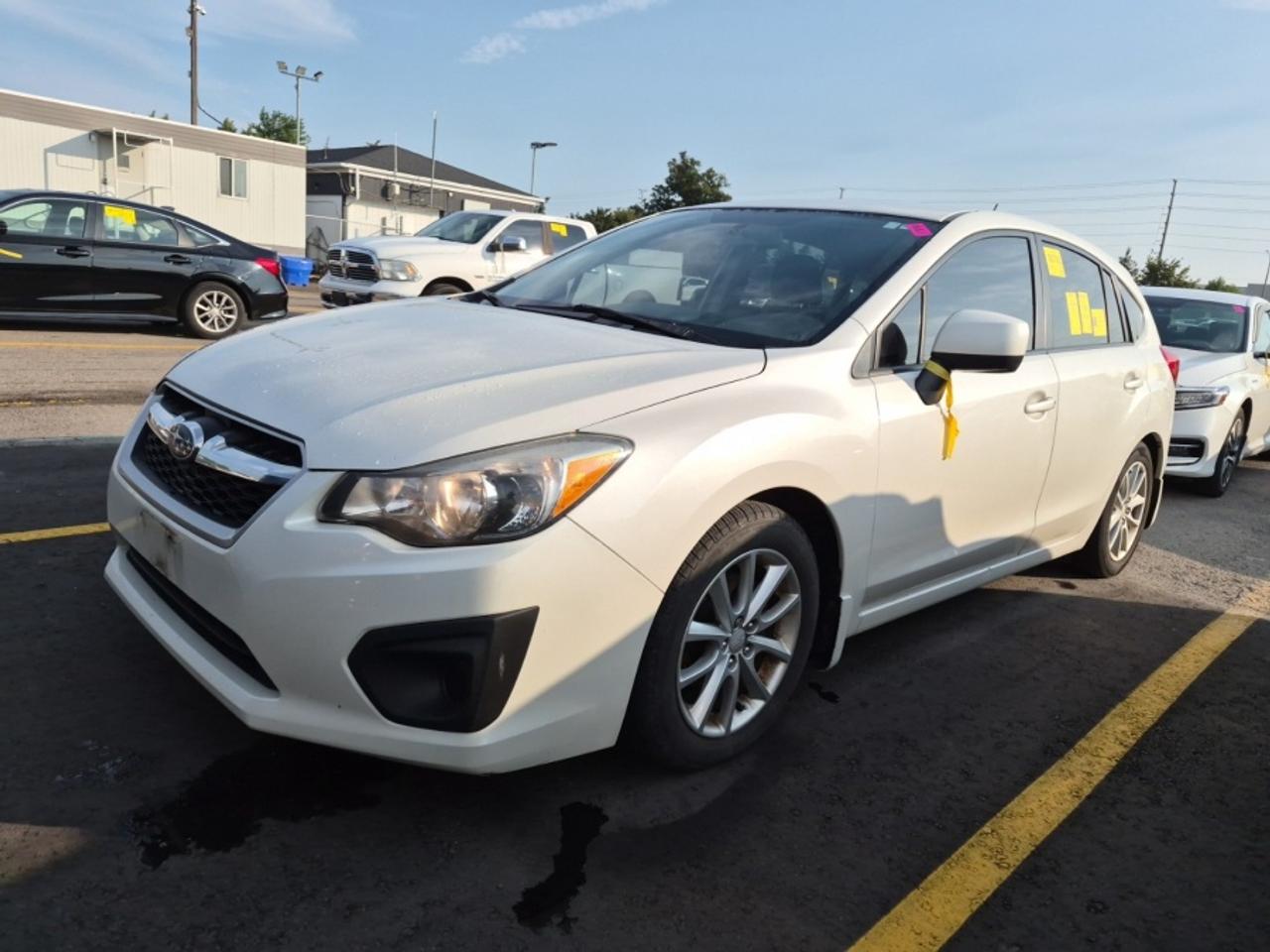 ** ** SPECIAL LIMITED TIME OFFER ** ** PURCHASE ANY VEHICLE THIS WEEK AND RECEIVE 4 BRAND-NEW ALL-SEASON TIRES AT NO ADDITIONAL COST!!! DON   T MISS THIS EXCLUSIVE CHANCE TO UPGRADE YOUR RIDE AND STAY PREPARED FOR ANY WEATHER!!! <br><br>EXCITING NEWS FROM FIRST CHOICE MOTORS! Our brand-new online showroom is now open to the public, bringing the ultimate car shopping experience right to your fingertips! Enjoy a 100% online car shopping experience, with over 500 certified vehicles in stock, comprehensive protection plans, and thousands of new auto parts & accessories available! Plus, for a limited time, were offering FREE deliveries across Ontario on all vehicle purchases! Dont miss out   visit Shop.fcmotors.ca to find and upgrade your perfect vehicle today!<br><br>Welcome to First Choice Motors, the largest car dealership in Toronto of pre-owned cars, SUVs, and vans priced between $5000-$15,000. With an impressive inventory of over 300 vehicles in stock, we are dedicated to providing our customers with a vast selection of affordable and reliable options. <br><br>Were thrilled to offer a used 2013 Subaru Impreza PREMIUM, white color with 179,000km (STK#10248) This vehicle was $8490 NOW ON SALE FOR $7990. It is equipped with the following features:<br>- Automatic Transmission<br>- Hatchback<br>- All wheel drive<br>- Bluetooth<br>- Alloy wheels<br>- Power windows<br>- Power locks<br>- Power mirrors<br>- Air Conditioning<br><br>At First Choice Motors, we believe in providing quality vehicles that our customers can depend on. All our vehicles come with a 36-day guarantee on all safety related items. We also offer additional warranty options up to 5 years for our customers who want extra peace of mind.<br><br>Furthermore, all our vehicles are sold fully certified with brand new brakes rotors and pads, a fresh oil change, and brand new set of all-season tires installed & balanced. You can be confident that this car is in excellent condition and ready to hit the road.<br><br>At First Choice Motors, we believe that everyone deserves a chance to own a reliable and affordable vehicle. Thats why we offer financing options with low interest rates starting at 7.9% O.A.C. Were proud to approve all customers, including those with bad credit, no credit, students, and even 9 socials. Our finance team is dedicated to finding the best financing option for you and making the car buying process as smooth and stress-free as possible.<br><br>Our dealership is open 7 days a week to provide you with the best customer service possible. We carry the largest selection of used vehicles for sale under $9990 in all of Ontario. We stock over 300 cars, mostly Hyundai, Chevrolet, Mazda, Honda, Volkswagen, Toyota, Ford, Dodge, Kia, Mitsubishi, Acura, Lexus, and more. With our ongoing sale, you can find your dream car at a price you can afford. Come visit us today and experience why we are the best choice for your next used car purchase!<br><br>All prices include $22.00 OMVIC Fee.  Excludes, license plates, ownership registration and ONTARIO HST (13%)<br>*No Credit Card payments can be accepted for Vehicle Purchases*