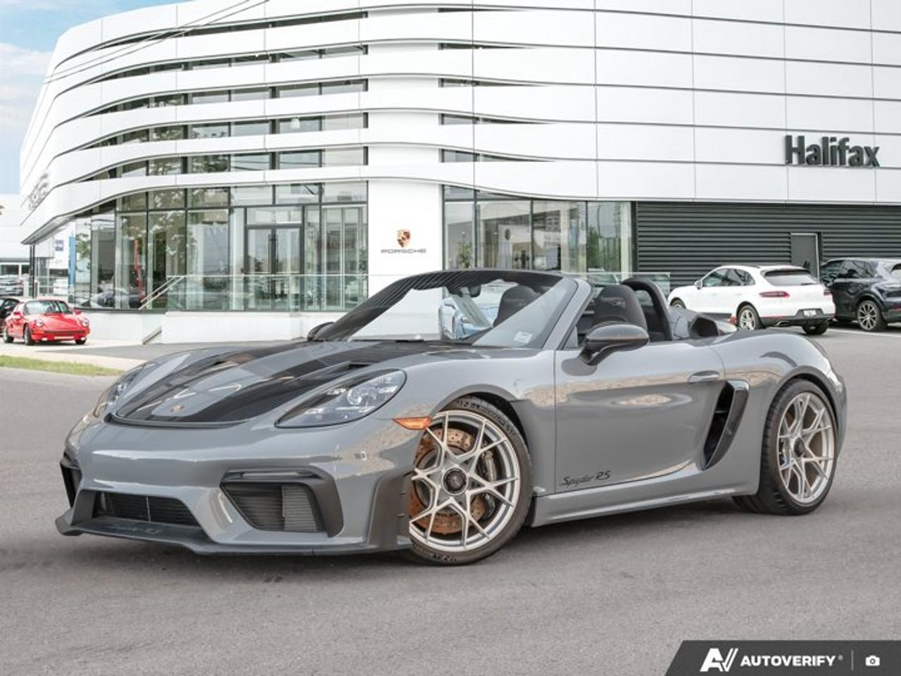 This 2025 Porsche 718 Spyder RS, now available at Porsche Of Halifax, is finished in Arctic Grey with a Leather/Race-Tex Interior in Black with Arctic Grey stitching and Weissach Package and is equipped with a PDK transmission.*Powertrain and Drivetrain*4.0-litre naturally aspirated flat-6 engine producing 493 horsepower and 331 lb-ft of torquePDK transmissionRear-wheel drive*Exterior*Arctic GreyWeissach PackageSpyder RS Top in Black with Grey AccentsFront Trunk Lid in Exposed Carbon Fiber/Partially PaintedFront Axle Lift SystemBrake Calipers in High Gloss BlackWheels Painted in Satin AluminumLED Headlights incl. Porsche Dynamic Light System (PDLS)*Interior and Seating*Leather/Race-Tex Interior in Black with Arctic Grey StitchingAdaptive Sport Seats Plus (18-way)Heated SeatsInstrument Dials in WhiteChrono Stopwatch Dial in WhiteSeat Belts in Arctic GreyDoor-Sill Guards in Carbon Fiber, IlluminatedSmartphone Compartment*Technology and Driver Assistance*BOSE® Surround Sound SystemAuto-Dimming Mirrors with Integrated Rain SensorPreparation for Porsche Dashcam (Front)Light Design PackageSmoking PackageLuggage Net in Passenger Footwell*Exclusive Manufaktur Details*Weissach PackageSpyder RS Top with Accents in Deviated ColorThis 718 Spyder RS is configured with a naturally aspirated motorsport-derived powertrain, extensive Weissach Package content, and a lightweight open-top design focused on driver engagement and performance.Visit www.porscheofhalifax.com or call (902)453-8800 to speak with a Porsche Sales Executive.