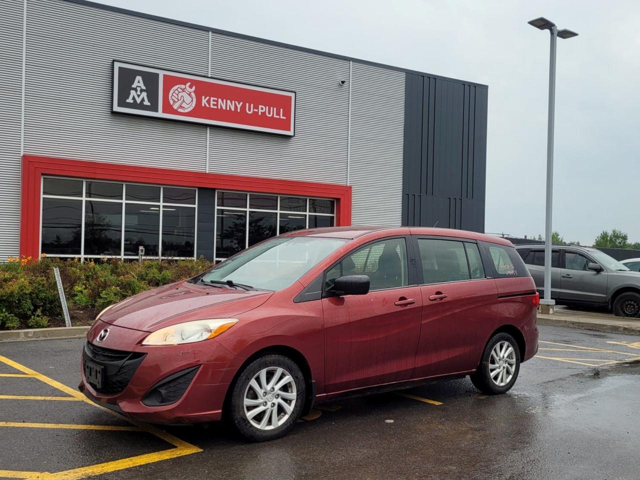 2012 Mazda 5 in Copper Red. The vehicle has 120,529km. The vehicle runs and drives. Check engine light is on. Some imperfections/rust around the body. We dont perform any mechanical/safety inspections. The vehicle is sold as is and might need some work.