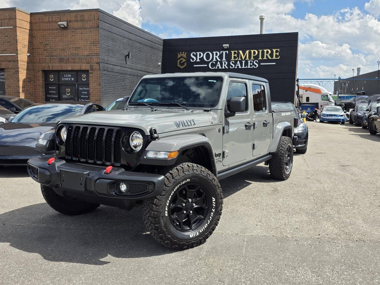 *NO ACCIDENT* *4X4* *HEATED SEATS* *HEATED STEERING WHEEL* *PUSH START* *REVERSE CAMERA* Safety Certificate NOT included in the price | SAFETY: $799 Year :2023 Make: Jeep Model: Gladiator Trim: Willys Kms: 54,526 km finance Price: $39,880 cash price: $40,880 Sport Empire Cars Offering a beautiful Jeep Gladiator with 54,526 kms!! NO ACCIDENTS CLEAN CARFAX For the affordable price of $39,880+HST and licensing. Beautiful gray exterior with a black interior. Professionally detailed and ready to go. Perfect combination of reliability, comfort and luxury. Buy with Trust with an Ontario registered dealer. Please note: The listed price is a finance-only special. If you wish to purchase the vehicle with cash, a $1,000 premium will be added to the sale price. ** In accordance with OMVIC regulations, please be advised that the vehicle being offered is not currently certified, e-tested or drivable. Certification is available for an additional fee starting from $799. With our safety package the vehicle comes with a 36 day safety standard warranty.