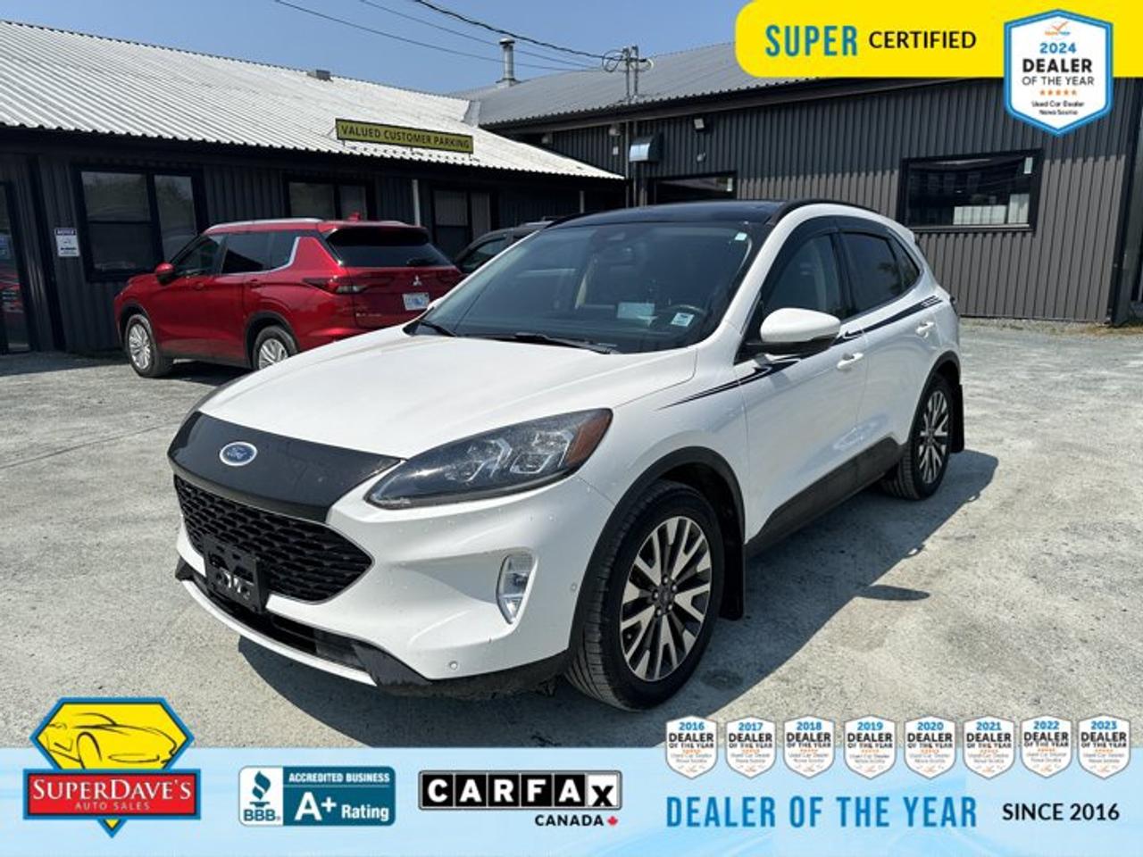 <p> ENGINE: 2.5L IVCT ATKINSON CYCLE I-4 HYBRID  (STD), Compass, Wireless Charging Pad, Wheels: 19 Machined-Face Alum w/Dk Tarnished Pnt, Trunk/Hatch Auto-Latch, Transmission: eCVT, Transmission w/Driver Selectable Mode and Oil Cooler, Tracker System, Tires: 225/55R19 99H A/S BSW -inc: mini spare, Tire Specific Low Tire Pressure Warning. This Ford ESCAPE has a dependable Gas/Electric I-4 2.5 L/152 engine powering this Automatic transmission. </p> <p>These Packages Will Make Your Ford ESCAPE TITANIUM HYBRID The Envy of Your Friends <br /> SYNC 3 Communications & Entertainment System -inc: enhanced voice recognition, 8 LCD capacitive touchscreen in centre stack w/swipe capability, AppLink, 911 Assist, Apple CarPlay and Android Auto and 2 smart-charging USB ports, Note: SYNC AppLink lets you control some of your favorite compatible mobile apps w/your voice, It is compatible w/select smartphone platforms, Commands may vary by phone and AppLink software, Streaming Audio, Speed Sensitive Rain Detecting Variable Intermittent Wipers, Smart Device Remote Engine Start, Smart Device Integration, Siriusxm Traffic Real-Time Traffic Display, Side Impact Beams, Short And Long Arm Rear Suspension w/Coil Springs, Securilock Anti-Theft Ignition (pats) Immobilizer, Seats w/Leatherette Back Material, Safety Canopy System Curtain 1st And 2nd Row Airbags, Remote Releases -Inc: Proximity Cargo Access and Power Fuel, Remote Keyless Entry w/Integrated Key Transmitter, Illuminated Entry, Illuminated Ignition Switch and Panic Button, Regenerative 4-Wheel Disc Brakes w/4-Wheel ABS, Front Vented Discs, Brake Assist, Hill Hold Control and Electric Parking Brake, Redundant Digital Speedometer, Rear Child Safety Locks, Radio: B&O Sound System by Bang & Olufsen w/SiriusXM -inc: subwoofer, speed-compensated volume, steering wheel mounted controls, USB media hub and 6-month prepaid subscription, HD Radio, Radio w/Seek-Scan, Clock, Radio Data System and SYNC 3 External Memory Control, Quasi-Dual Stainless Steel Exhaust w/Chrome Tailpipe Finisher, Proximity Key For Doors And Push Button Start. </p><br><p>THE SUPER DAVES ADVANTAGE</p> <p>BUY REMOTE - No need to visit the dealership. Through email, text, or a phone call, you can complete the purchase of your next vehicle all without leaving your house!</p> <p>DELIVERED TO YOUR DOOR - Your new car, delivered straight to your door! When buying your car with Super Daves, well arrange a fast and secure delivery. Just pick a time that works for you and well bring you your new wheels!</p> <p>PEACE OF MIND WARRANTY - Every vehicle we sell comes backed with a warranty so you can drive with confidence.</p> <p>EXTENDED COVERAGE - Get added protection on your new car and drive confidently with our selection of competitively priced extended warranties.</p> <p>WE ACCEPT TRADES - We&rsquo;ll accept your trade for top dollar! We&rsquo;ll assess your trade in with a few quick questions and offer a guaranteed value for your ride. We&rsquo;ll even come pick up your trade when we deliver your new car.</p> <p>SUPER CERTIFIED INSPECTION - Every vehicle undergoes an extensive 120 point inspection, that ensure you get a safe, high quality used vehicle every time.</p> <p>FREE CARFAX VEHICLE HISTORY REPORT - If youre buying used, its important to know your cars history. Thats why we provide a free vehicle history report that lists any accidents, prior defects, and other important information that may be useful to you in your decision.</p> <p>METICULOUSLY DETAILED &ndash; Buying used doesn&rsquo;t mean buying grubby. We want your car to shine and sparkle when it arrives to you. Our professional team of detailers will have your new-to-you ride looking new car fresh.</p> <p>(Please note that we make all attempt to verify equipment, trim levels, options, accessories, kilometers and price listed in our ads however we make no guarantees regarding the accuracy of these ads online. Features are populated by VIN decoder from manufacturers original specifications. Some equipment such as wheels and wheels sizes, along with other equipment or features may have changed or may not be present. We do not guarantee a vehicle manual, manuals can be typically found online in the rare event the vehicle does not have one. Please verify all listed information with our dealership in person before purchase. The sale price does not include any ongoing subscription based services such as Satellite Radio. Any software or hardware updates needed to run any of these systems would also be the responsibility of the client. All listed payments are OAC which means On Approved Credit and are estimated without taxes and fees as these may vary from deal to deal, taxes and fees are extra. As these payments are based off our lenders best offering they may be subject to change without notice. Please ensure this vehicle is ready to be viewed at the dealership by making an appointment with our sales staff. We cannot guarantee this vehicle will be on premises and ready for viewing unless and appointment has been made.)</p>