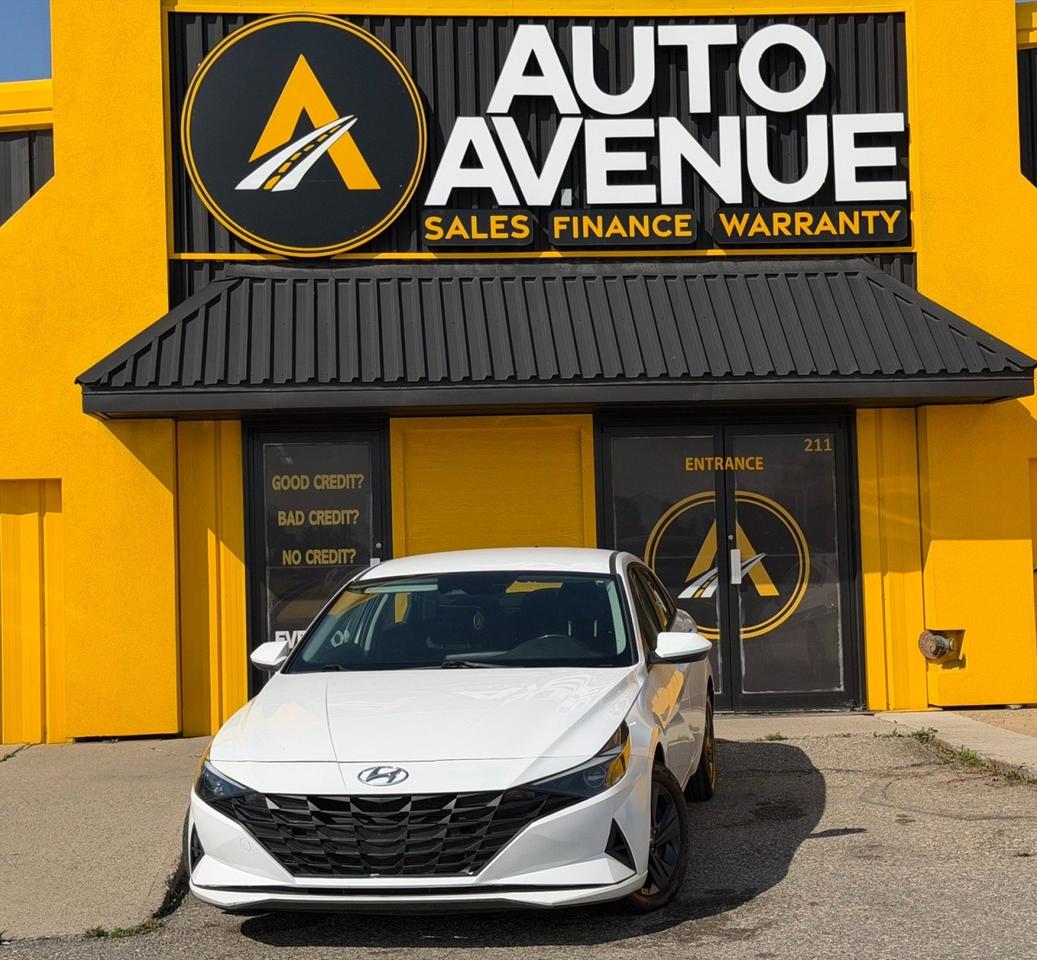 This outstanding example of a 2021 Hyundai Elantra Essential is proudly offered by Auto Avenue Airdrie. <br/> This stylish and reliable sedan perfectly combines modern design, everyday comfort, and practicality, making it an excellent choice for both city driving and the open road. With its sleek exterior, comfortable interior, and impressive fuel efficiency, the Hyundai Elantra delivers everything you need in a dependable and affordable vehicle. <br/> Equipped with a backup camera and heated front seats, this Elantra is designed to make every drive more convenient and enjoyable. Whether youre commuting to work, running errands, or heading out on a weekend adventure, this vehicle provides the comfort, confidence, and practicality you&rsquo;re looking for. <br/> With 156,305 km, this 2021 Hyundai Elantra Essential represents an excellent opportunity to get behind the wheel of a well-equipped, modern sedan at an attractive value. <br/> A truly impressive example of modern automotive design - this Hyundai Elantra is more than just a sedan. It could be the vehicle you&rsquo;ve been looking for! <br/> AUTO AVENUE IS AN AMVIC LICENSED DEALERSHIP, COMMITTED TO PROVIDING EXCEPTIONAL SERVICE AND QUALITY VEHICLES WITH FLEXIBLE PAYMENT OPTIONS. <br/>