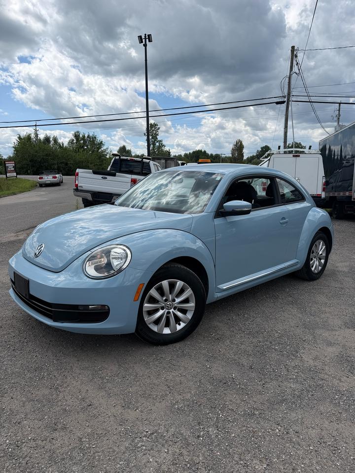 <p>2013 VOLKSWAGEN BEETLE COMFORTLINE BLUE - UNIQUE, CLEAN & FUN TO DRIVE!</p><p>VERY CLEAN - SHARP LOOKING BEETLE COMFORTLINE WITH A CLASSIC STYLE, SMOOTH DRIVE AND FUN PERSONALITY!</p><p>FUEL-EFFICIENT GAS ENGINE - EASY TO DRIVE, EASY TO PARK & GREAT FOR COMMUTING, CITY DRIVING OR DAILY USE!</p><p>COMFORTLINE TRIM WELL EQUIPPED WITH PRACTICAL FEATURES INCLUDING BLUETOOTH, CRUISE CONTROL, POWER WINDOWS, POWER LOCKS & A COMFORTABLE INTERIOR!</p><p>ICONIC BEETLE DESIGN WITH A STYLISH BLUE EXTERIOR, COMFORTABLE CABIN AND THE UNIQUE LOOK THAT MAKES IT STAND OUT FROM A REGULAR COMPACT CAR!</p><p>PERFECT FOR DAILY DRIVING, COMMUTING, STUDENTS, FIRST-TIME BUYERS OR ANYONE LOOKING FOR A CLEAN, AFFORDABLE & FUN-TO-DRIVE VEHICLE!</p><p>EASY FINANCING AVAILABLE!</p><p>ADVERTISED PRICE IS OUR FINANCE PRICE.</p><p>DRIVETOWNOTTAWA.COM - COME VISIT US / VENEZ NOUS VISITER!</p><p>TAXES AND LICENSING EXTRA. SEE DRIVETOWNOTTAWA.COM FOR CASH PRICE. FINANCING CHARGES APPLY, INCLUDING BANK FEES, PPSA AND INTEREST. QUEBEC SAFETY FEE APPLICABLE.</p>