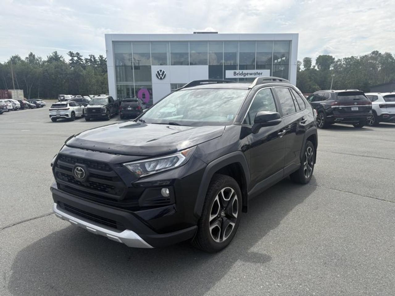 Recent Arrival! 2020 Toyota RAV4 TrailAWD | Apple CarPlay | Android Auto | Sirus XM Radio Certified.This vehicle is a Steele Certified Pre-Owned Vehicle, offering added confidence through enhanced inspection standards and dealership-backed benefits. Steele Certified Reconditioning Process: Comprehensive multi-point inspection Mechanical and cosmetic reconditioning completed as needed Brake, tire, and battery assessment Professional detailing Final quality control road test Steele Certified Pre-Owned vehicles include additional ownership benefits. Any concerns related to the certification process must be reviewed and addressed by the original selling dealer.CARFAX Canada No Reported AccidentsMidnight Black Metallic AWD 8-Speed Automatic 2.5L 4-Cylinder DOHC AWD, Black w/SofTex Seat Trim, 19 Alloy Wheels, 3.177 Axle Ratio, 4-Wheel Disc Brakes, 6 Speakers, ABS brakes, Air Conditioning, Alloy wheels, AM/FM radio: SiriusXM, Apple CarPlay/Android Auto, Auto High-beam Headlights, Automatic temperature control, Brake assist, Bumpers: body-colour, Connected Services by Toyota, Delay-off headlights, Driver door bin, Driver vanity mirror, Dual front impact airbags, Dual front side impact airbags, Electronic Stability Control, Emergency communication system: Safety Connect (Connected Services by Toyota), Exterior Parking Camera Rear, Four wheel independent suspension, Front anti-roll bar, Front Bucket Seats, Front dual zone A/C, Front fog lights, Front reading lights, Fully automatic headlights, Heated & Ventilated Front Bucket Seats, Heated door mirrors, Heated front seats, Heated steering wheel, Illuminated entry, Knee airbag, Leather Shift Knob, Occupant sensing airbag, Outside temperature display, Overhead airbag, Overhead console, Panic alarm, Passenger door bin, Passenger vanity mirror, Power door mirrors, Power driver seat, Power Liftgate, Power moonroof, Power steering, Power windows, Radio: Audio Plus w/Remote, Rain sensing wipers, Rear anti-roll bar, Rear window defroster, Rear window wiper, Remote keyless entry, Roof rack: rails only, Safety Connect, Security system, SofTex Seat Trim, Speed control, Speed-sensing steering, Split folding rear seat, Spoiler, Steering wheel mounted audio controls, Tachometer, Telescoping steering wheel, Tilt steering wheel, Traction control, Trip computer, Turn signal indicator mirrors, Variably intermittent wipers, Ventilated front seats.