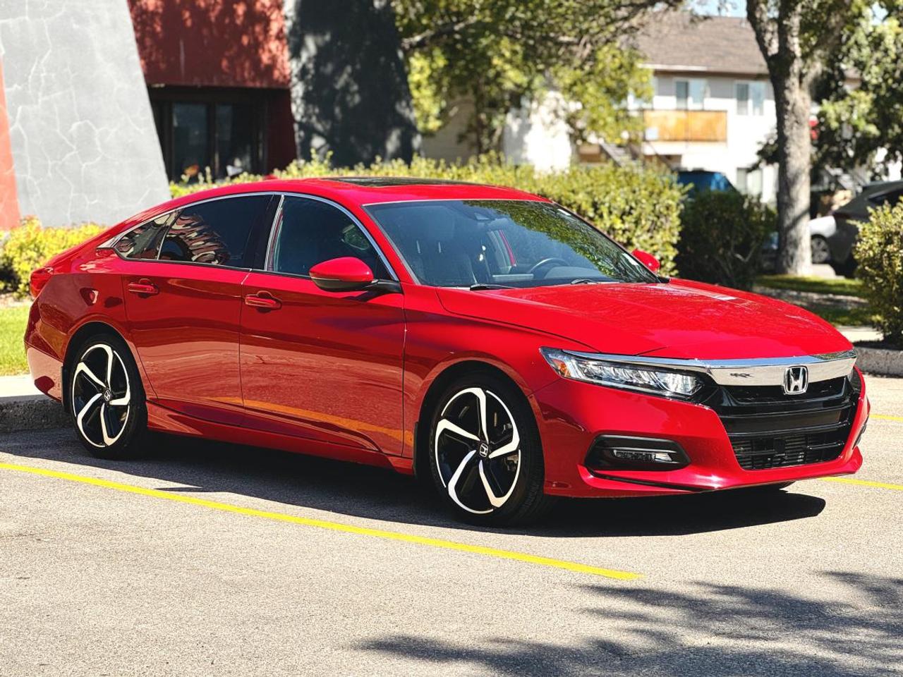 LOW KM | 6-SPEED MANUAL | 2018 Honda Accord Sport 1.5T - Turbo | Leather | 49,986 KM | For Sale in Saskatoon, SK

VIN: 1HGCV1E31JA807891
Mileage: 49,986 KM
Exterior Color: San Marino Red
Interior: Premium Black Leather
Trim: Sport 1.5T
Transmission: 6-Speed Manual
Drivetrain: Front-Wheel Drive
Engine: 1.5L Turbocharged 4-Cylinder
Body Style: Sedan
Condition: Low Kilometres | Sport | Manual Transmission

2018 Honda Accord Sport 1.5T 6-Speed Manual for Sale in Saskatoon, Saskatchewan

Looking for a 2018 Honda Accord Sport Manual for sale in Saskatoon? This exceptionally low-kilometre Accord is a rare find, combining Hondas turbocharged 1.5L VTEC® engine with a true 6-speed manual transmission and the aggressive styling of the Sport trim.

Finished in striking San Marino Red with a Premium Black Leather Interior, this 2018 Honda Accord Sport has only 49,986 KM. For driving enthusiasts searching for a practical four-door sedan without giving up the engagement of a manual transmission, this Accord deserves serious consideration.

The turbocharged 1.5L 4-cylinder produces approximately 192 horsepower and 192 lb-ft of torque, with the 6-speed manual putting the driver in complete control. Add Hondas responsive chassis, Sport mode-inspired styling, 19-inch wheels, and excellent fuel efficiency, and you have a sedan thats equally comfortable commuting through Saskatoon or heading out on the highway.

Available now at Platinum Auto Sport in Saskatoon, this low-kilometre manual Accord is a particularly interesting option for enthusiasts searching for a combination thats becoming increasingly difficult to find.

1.5L VTEC® Turbo + 6-Speed Manual

The combination that makes this Accord stand out is underneath the hood and between the front seats.

Performance Features
1.5L DOHC VTEC® Turbocharged 4-Cylinder Engine
Approximately 192 Horsepower
Approximately 192 lb-ft of Torque
6-Speed Manual Transmission
Front-Wheel Drive
Direct Fuel Injection
Eco Assisu System
ECON Mode
Electric Power-Assisted Rack-and-Pinion Steering
MacPherson Strut Front Suspension
Independent Multi-Link Rear Suspension
Front & Rear Stabilizer Bars
Four-Wheel Disc Brakes
Electronic Parking Brake
Automatic Brake Hold
Vehicle Stability Assist
Traction Control
Hill Start Assist

This combination gives the Accord Sport a much more engaging driving character than a conventional automatic family sedan while retaining Hondas excellent everyday usability.

Sport Trim - Aggressive Accord Styling

The Sport trim gives the Accord a noticeably more athletic appearance.

Sport Features
19-Inch Aluminum Alloy Wheels
Sport Exterior Styling
Dual Exhaust Finishers
Rear Decklid Spoiler
Sport Pedals
Leather-Wrapped Steering Wheel
Leather-Wrapped Manual Shift Knob
LED Lighting
Dark Exterior Accents
Premium Interior Trim
Sport-Inspired Seating
San Marino Red Exterior

The combination of San Marino Red, 19-inch wheels, Sport styling, and a manual transmission makes this Accord considerably more distinctive than the typical midsize sedan.

Premium Black Interior

Inside, the Accord Sport combines a driver-focused cockpit with the space and comfort expected from a midsize Honda sedan.

Comfort & Convenience Features
Premium Black Leather Seating
Heated Front Seats
Power Driver Seat
Leather-Wrapped Steering Wheel
Leather-Wrapped Manual Shift Knob
Dual-Zone Automatic Climate Control
Push Button Start
Proximity Key Entry
Power Windows
Power Door Locks
Heated Power Exterior Mirrors
Tilt & Telescopic Steering Wheel
Sport Pedals
Front Centre Armrest
Rear Centre Armrest
Rear Passenger Air Vents
60/40 Split Folding Rear Seatback
Spacious Five-Passenger Cabin
Large Trunk
Honda Display Audio & Smartphone Connectivity

The Accords modern cabin provides the smartphone integration and connectivity expected from a contemporary daily driver.

Technology Features
8-Inch Display Audio Touchscreen
Apple CarPlay®
Android Auto
Bluetooth® Hands-FreeLink
Bluetooth® Streaming Audio
USB Smartphone Connectivity
Steering Wheel Mounted Audio Controls
Multi-Angle Rearview Camera
Driver Information Interface
SMS Text Message Function
HondaLink Capability
Multiple Power Outlets
Premium Audio System
Speed-Sensitive Volume Control
Honda Sensing® Safety Technology

The 2018 Accord was an important step forward for Hondas active safety technology, with Honda Sensing providing additional driver assistance for everyday driving.

Honda Sensing® & Safety Features
Collision Mitigation Braking System
Forward Collision Warning
Road Departure Mitigation System
Lane Departure Warning
Lane Keeping Assist System
Adaptive Cruise Control
Traffic Sign Recognition
Auto High-Beam Headlights
Multi-Angle Rearview Camera
Vehicle Stability Assisu
Traction Control
Anti-Lock Braking System
Electronic Brake-Force Distribution
Brake Assist
Hill Start Assist
Tire Pressure Monitoring System
Advanced Front Airbags
Side-Impact Airbags
Side Curtain Airbags
LATCH Child Seat Anchors
San Marino Red Sport Exterior

San Marino Red is an excellent match for the Accord Sports more aggressive styling.

Exterior Highlights
San Marino Red Exterior
19-Inch Sport Alloy Wheels
LED Headlights
LED Daytime Running Lights
LED Taillights
Automatic Headlights
Auto High Beams
Heated Power Exterior Mirrors
Rear Decklid Spoiler
Dual Exhaust Finishers
Sport Exterior Trim
Body-Coloured Door Handles
Variable Intermittent Windshield Wipers
Aerodynamic Body Design
Spacious & Practical Sedan

Unlike many enthusiast-oriented vehicles, the Accord doesnt require sacrificing everyday usability.

Practical Features
Four Full-Size Doors
Seating for Five Passengers
Excellent Rear Legroom
Spacious Rear Seating
60/40 Split Folding Rear Seats
Large Trunk
Rear Passenger Air Vents
Front & Rear Cupholders
Multiple Interior Storage Compartments
Excellent Highway Comfort
Fuel-Efficient Turbocharged Engine

That makes this Accord particularly appealing for someone who wants a manual transmission performance-oriented daily driver that can still comfortably handle family, commuting, and road-trip duties.

Why Buy This 2018 Honda Accord Sport Manual?
ONLY 49,986 KM
Rare 6-Speed Manual Transmission
1.5L VTEC® Turbo Engine
Approximately 192 Horsepower
Approximately 192 lb-ft of Torque
Sport Trim
Stunning San Marino Red
Premium Black Leather Interior
Heated Front Seats
19-Inch Sport Alloy Wheels
Dual Exhaust Finishers
Rear Spoiler
Apple CarPlay®
Android Auto
8-Inch Touchscreen
Multi-Angle Backup Camera
Honda Sensing®
Adaptive Cruise Control
Lane Keeping Assist
Collision Mitigation Braking
Excellent Fuel Economy
Spacious Five-Passenger Interior
Legendary Honda Reputation
Rare Enthusiast-Friendly Sedan

With only 49,986 KM, this is an especially attractive example for anyone specifically searching for a low-kilometre manual Honda Accord in Canada.

In-House Financing at Platinum Auto Sport Saskatoon

At Platinum Auto Sport in Saskatoon, we specialize in helping customers explore automotive financing options for virtually every type of credit situation.

Our experienced finance team works with multiple Canadian banks and automotive lenders to help find financing options based on each customers individual credit profile, income, budget, and vehicle selection.

Financing Options for All Types of Credit
Excellent Credit
Good Credit
Bad Credit
No Credit
Credit Rebuilding
First-Time Buyers
New to Canada
Self-Employed Customers
Previous Bankruptcy
Consumer Proposal
Trade-Ins Welcome

Whether youre searching for Honda Accord financing in Saskatoon, bad credit car financing in Saskatchewan, used car financing, first-time buyer auto financing, new-to-Canada vehicle financing, or financing for a sporty manual-transmission vehicle, Platinum Auto Sport can help you explore available options.

Serving Honda Buyers Across Saskatchewan

Platinum Auto Sport proudly serves customers throughout Saskatoon, Regina, Prince Albert, Moose Jaw, North Battleford, Yorkton, Swift Current, Weyburn, Estevan, Warman, Martensville, and communities across Saskatchewan.

If youre searching for a 2018 Honda Accord Sport for sale in Saskatoon, manual Honda Accord in Saskatchewan, low-kilometre Honda Accord, Honda Accord 1.5T 6-speed manual, or a sporty fuel-efficient sedan, this Accord deserves a closer look.

Why Buy From Platinum Auto Sport?

Platinum Auto Sport is a Saskatoon used vehicle dealership specializing in quality pre-owned cars, SUVs, trucks, luxury vehicles, and performance vehicles.

We offer:

Financing Options for All Types of Credit
Multiple Lending Partners
Competitive Trade-In Values
Trade-Ins Welcome
Extended Warranty Options Available
Professionally Inspected Vehicles
Vehicle Delivery Options
Straightforward, No-Pressure Buying Experience
Quality Pre-Owned Inventory
Book Your Test Drive Today

Finding an Accord is easy. Finding a low-kilometre 2018 Honda Accord Sport with the 1.5L turbo and a 6-speed manual transmission is considerably harder.

With only 49,986 KM, a striking San Marino Red exterior, Premium Black Leather Interior, Sport trim, 19-inch wheels, Honda Sensing technology, and a genuine manual gearbox, this Accord offers an increasingly rare combination of performance, practicality, efficiency, and driver engagement.

Visit Platinum Auto Sport at 330 22nd Street West in Saskatoon, Saskatchewan, or apply online today to explore your financing options.

Platinum Auto Sport - Saskatoons destination for quality pre-owned Honda vehicles, low-kilometre cars, manual transmission and performance vehicles, trade-ins, and financing solutions for all types of credit across Saskatchewan.