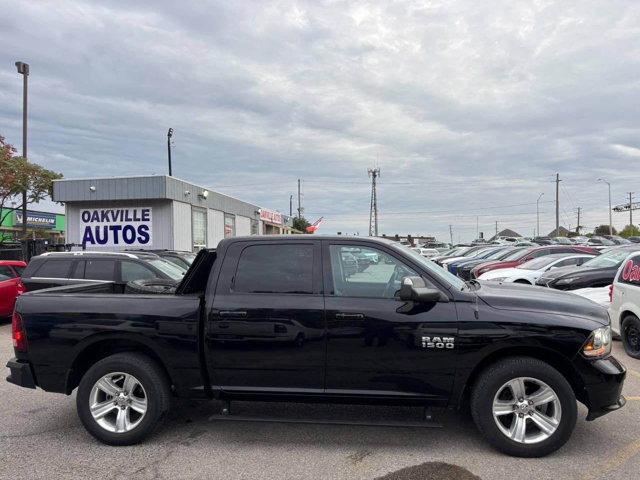 2014 RAM 1500 4WD Crew Cab 140.5" Sport Photo