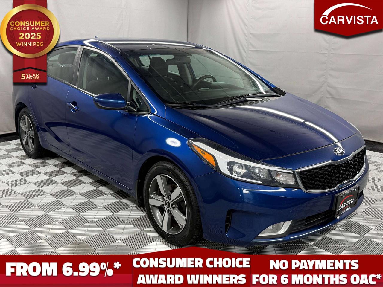 This 2018 Kia Forte LX+ is a practical sedan that makes a strong choice for everyday commuting and family driving. With nearly 98,000 km on the odometer, it offers lightly used reliability paired with useful comfort and convenience features including heated seats, a back-up camera, and Bluetooth connectivity for seamless phone and audio integration.

Key Features

    
Registration: 2018 model year, 97,350 km

    
Powertrain: 2.0L 4-cylinder gasoline engine with 145 horsepower, automatic transmission, front-wheel drive

    
Comfort & Convenience: Heated seats, steering wheel audio controls

    
Technology: Bluetooth connection for calls and music, steering wheel audio controls

    
Safety & Driver Assistance: Back-up camera, cruise control, fog lights, alarm, engine immobilizer



This Forte combines economical everyday transportation with thoughtful equipment that makes driving more convenient. The back-up camera and cruise control help simplify parking and longer highway drives, while heated seats add comfort during cooler months. Bluetooth keeps you connected safely on the road, and the fog lights improve visibility in challenging conditions.


Contact Carvista today to learn more or to arrange a test drive.