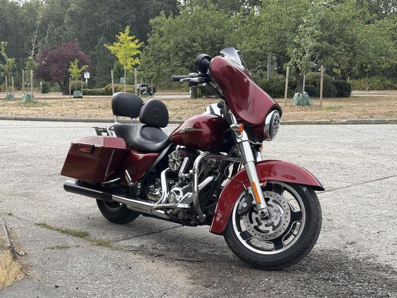 This 2009 Harley-Davidson Street Glide FLHX is powered by a 1,584cc Twin Cam 96 V-Twin engine paired with a 6-speed manual transmission. Configured as a two-passenger touring motorcycle, the Street Glide combines classic Harley-Davidson styling with comfort and equipment suited for recreational riding and longer-distance touring.

The motorcycle features two-passenger leather seating, Rinehart Racing exhaust pipes, Harley-Davidson saddlebags, a rear luggage rack, cruise control, and an AM/FM audio system.

Overall dimensions are approximately 8 feet long, 3 feet wide, and 4 feet 8 inches high.

Finished in red with black seating, this Harley-Davidson Street Glide FLHX combines V-Twin touring performance, practical luggage capacity, and upgraded exhaust equipment in a distinctive touring motorcycle package. This item is currently OFFSITE. You must register an appointment with our office to schedule an offsite viewing. Appointments must be made a minimum of one business day in advance (and as defined by the days that Repo.com is open for business) before your appointment can be scheduled and confirmed. We may, at our own discretion, instead opt to transport smaller items to Repo.coms main yard for viewing purposes.  $9,830.00 plus $375 processing fee, $10,205.00 total payment obligation before taxes.   Listing report, warranty, contract commitment cancellation fee. All above specifications and information is considered to be accurate but is not guaranteed and no opinion or advice is given as to whether this item should be purchased. We do not allow test drives due to theft, fraud, acts of vandalism and undetectable impaired driving. Instead we provide the following benefits: Complimentary Warranty (with options to extend), Limited Money Back Satisfaction Guarantee on Fully Completed Contracts, Contract Commitment Cancellation, and an Open-Ended Sell-Back Option. Ask seller for details or call 604-522-REPO(7376) to confirm listing availability.