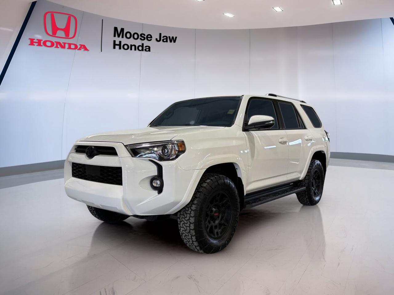 Meet the 2022 Toyota 4Runner Base, a rugged sport utility vehicle built for drivers who want proven durability, everyday comfort, and true body-on-frame capability. Finished in White and equipped with an automatic transmission, this used 4Runner at Moose Jaw Honda in Moose Jaw has 58,618 km and delivers the toughness that has made this model a trusted choice across Canada.

The 2022 Toyota 4Runner Base is known for its strong road presence, dependable engineering, and practical design. It suits busy daily driving, weekend travel, and rougher road conditions with ease. Its reputation comes from real capability, simple controls, and the confidence of a vehicle designed to handle changing seasons and varied terrain.

FEATURES OF THE 4Runner Base

»» Rugged body-on-frame sport utility design
»» Automatic transmission for smooth daily driving
»» White exterior with timeless, clean appeal
»» Proven Toyota utility and durability

ADVANCED SAFETY FEATURES

»» Rearview camera aids reversing and parking
»» Toyota Safety Sense driver-assist technology
»» Stability control supports confident handling
»» Multiple airbags enhance occupant protection

PERFORMANCE AND EFFICIENCY

»» Strong V6 engine delivers solid power
»» Automatic transmission shifts smoothly and confidently
»» Rear-wheel drive based utility platform
»» Built for towing and rough roads

COMFORT AND CONVENIENCE

»» Spacious cabin with practical layout
»» Easy step-in height for passengers
»» Climate control supports year-round comfort
»» Ample visibility helps daily driving

TECHNOLOGY AND CONNECTIVITY

»» Touchscreen interface keeps functions easy
»» Bluetooth connectivity supports hands-free calling
»» USB input adds device convenience
»» Clear driver information display layout

CARGO SPACE

»» Large rear cargo area available
»» Flexible storage for daily gear
»» Wide opening eases loading tasks
»» Roomy design suits travel needs

AWARDS & RECOGNITIONS

»» Best Resale Value Award, Canadian Black Book, 2022

WHAT OTHER OWNERS LIKE

»» Strong long-term durability and dependability
»» Confident winter and rough-road capability
»» Practical cargo room for active lifestyles
»» Smooth ride with sturdy feel

The 2022 Toyota 4Runner Base stands out for buyers who value proven utility over trends. Its classic SUV design, solid performance, and useful interior make it a smart option for families, commuters, and outdoor-focused drivers alike. The white finish adds a crisp, clean look that stays appealing in every season.

At Moose Jaw Honda, this used 4Runner offers a rare mix of toughness and everyday usability. With 58,618 km, automatic transmission, and the lasting confidence Toyota utility vehicles are known for, it is ready for work, travel, and daily life in Moose Jaw and beyond.

This 2022 Toyota 4Runner Bases VIN is: JTENU5JR7N6067408 .<p>618 km and delivers the toughness that has made this model a trusted choice across Canada.

The 2022 Toyota 4Runner Base is known for its strong road presence</p>
<p> and the confidence of a vehicle designed to handle changing seasons and varied terrain.

FEATURES OF THE 4Runner Base

»» Rugged body-on-frame sport utility design
»» Automatic transmission for smooth daily driving
»» White exterior with timeless</p>
<p> clean appeal
»» Proven Toyota utility and durability

ADVANCED SAFETY FEATURES

»» Rearview camera aids reversing and parking
»» Toyota Safety Sense driver-assist technology
»» Stability control supports confident handling
»» Multiple airbags enhance occupant protection

PERFORMANCE AND EFFICIENCY

»» Strong V6 engine delivers solid power
»» Automatic transmission shifts smoothly and confidently
»» Rear-wheel drive based utility platform
»» Built for towing and rough roads

COMFORT AND CONVENIENCE

»» Spacious cabin with practical layout
»» Easy step-in height for passengers
»» Climate control supports year-round comfort
»» Ample visibility helps daily driving

TECHNOLOGY AND CONNECTIVITY

»» Touchscreen interface keeps functions easy
»» Bluetooth connectivity supports hands-free calling
»» USB input adds device convenience
»» Clear driver information display layout

CARGO SPACE

»» Large rear cargo area available
»» Flexible storage for daily gear
»» Wide opening eases loading tasks
»» Roomy design suits travel needs

AWARDS & RECOGNITIONS

»» Best Resale Value Award</p>
<p> 2022

WHAT OTHER OWNERS LIKE

»» Strong long-term durability and dependability
»» Confident winter and rough-road capability
»» Practical cargo room for active lifestyles
»» Smooth ride with sturdy feel

The 2022 Toyota 4Runner Base stands out for buyers who value proven utility over trends. Its classic SUV design</p>
<p> and daily life in Moose Jaw and beyond.

This 2022 Toyota 4Runner Bases VIN is: JTENU5JR7N6067408 .</p>