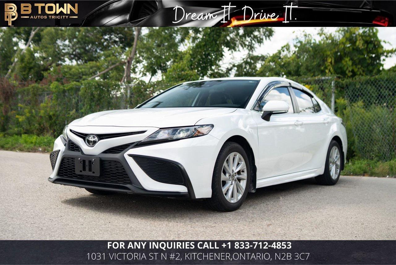 <strong>2022 Toyota Camry SE</strong>




<span>Finished in </span><span>White</span><span>, this 2022 Toyota Camry SE combines sporty styling, comfortable everyday driving, excellent practicality, and Toyota reliability.</span>




<span>Powered by a </span><span>2.5L 4-cylinder gasoline engine</span><span> paired with an </span><span>8-speed automatic transmission</span><span>, delivering smooth performance and impressive fuel efficiency.</span>




<strong>Key Features & Options:</strong>

<ul>
<li><span>2.5L 4-Cylinder Engine</span></li>
</ul>
<ul>
<li><span>8-Speed Automatic Transmission</span></li>
</ul>
<ul>
<li><span>SE Sport Styling</span></li>
</ul>
<ul>
<li><span>Heated Front Seats</span></li>
</ul>
<ul>
<li><span>Power Driver Seat</span></li>
</ul>
<ul>
<li><span>Touchscreen Infotainment System</span></li>
</ul>
<ul>
<li><span>Apple CarPlay & Android Auto</span></li>
</ul>
<ul>
<li><span>Bluetooth Connectivity</span></li>
</ul>
<ul>
<li><span>Backup Camera</span></li>
</ul>
<ul>
<li><span>Adaptive Cruise Control</span></li>
</ul>
<ul>
<li><span>Lane Departure Alert</span></li>
</ul>
<ul>
<li><span>Lane Tracing Assist</span></li>
</ul>
<ul>
<li><span>Pre-Collision System</span></li>
</ul>
<ul>
<li><span>Automatic High Beams</span></li>
</ul>
<ul>
<li><span>Automatic Climate Control</span></li>
</ul>
<ul>
<li><span>Steering Wheel Audio Controls</span></li>
</ul>
<ul>
<li><span>Keyless Entry</span></li>
</ul>
<ul>
<li><span>LED Headlights</span></li>
</ul>
<ul>
<li><span>Alloy Wheels</span></li>
</ul>






<strong>At B-Town Auto Tricity, each vehicle undergoes a comprehensive inspection to ensure exceptional quality and performance. We proudly serve customers across the Greater Toronto Area and beyond, offering competitive financing, trade-ins, and nationwide shipping.</strong>




<strong>$999 FINANCING FEES APPLY.</strong>




<strong>Special Financing Price: $25,888</strong>

<strong>Cash Price: $27,388</strong>




<strong>Thank you for choosing B-Town Auto Tricity.</strong>