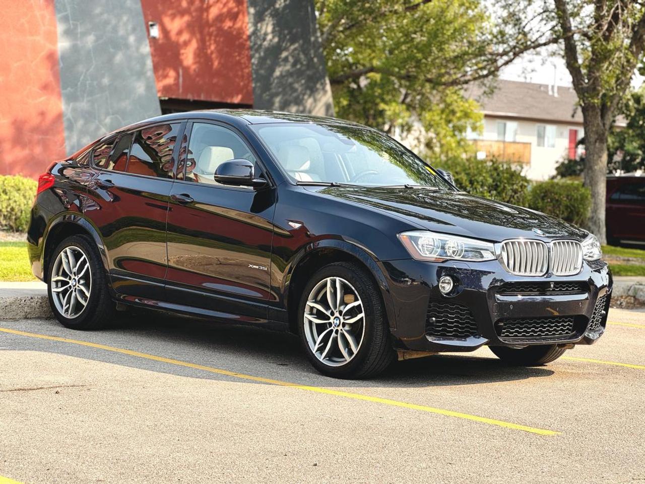 LOW KM | 3.0L TURBO I6 | 2016 BMW X4 xDrive35i AWD Sports Activity Coupe | Leather | Panoramic Roof | For Sale in Saskatoon, SK

VIN: 5UXXW5C53G0N93265
Mileage: 99,503 KM
Exterior Color: Carbon Black Metallic
Interior: Premium Beige Leather
Model: BMW X4 xDrive35i
Body Style: Sports Activity Coupe
Engine: 3.0L TwinPower Turbo Inline 6-Cylinder
Power: 320 HP | 320 lb-ft Torque
Transmission: 8-Speed Sport Automatic
Drivetrain: BMW xDrive All-Wheel Drive
Fuel: Premium Gasoline
Seating: 5 Passengers

2016 BMW X4 xDrive35i 3.0L AWD for Sale in Saskatoon, Saskatchewan

Looking for a 2016 BMW X4 xDrive35i for sale in Saskatoon, Saskatchewan? This low-kilometre luxury crossover combines the sleek profile of a performance coupe with the versatility, cargo space, elevated driving position, and all-weather capability of an SUV.

Finished in stunning Carbon Black Metallic with a contrasting Premium Beige Leather Interior, this BMW X4 has only 99,503 KM and is powered by the desirable 3.0L TwinPower Turbo inline 6-cylinder engine.

The xDrive35i produces 320 horsepower and 320 lb-ft of torque, paired with BMWs 8-speed Sport Automatic transmission and intelligent xDrive All-Wheel Drive. This is a significant performance upgrade over the 4-cylinder X4 xDrive28i and gives the X4 the smooth, responsive power delivery BMWs turbocharged inline-six engines are known for.

Available now at Platinum Auto Sport in Saskatoon, this X4 is an excellent choice for buyers searching for a low-kilometre BMW, European luxury AWD SUV, or performance crossover in Saskatchewan.

3.0L TwinPower Turbo Inline-6 Performance

The heart of this X4 is BMWs turbocharged 3.0L inline-six, delivering substantially more power and torque than the four-cylinder xDrive28i.

Performance & Mechanical Features
3.0L TwinPower Turbo Inline 6-Cylinder
300 Horsepower
300 lb-ft of Torque
Direct Fuel Injection
8-Speed Sport Automatic Transmission
STEPTRONIC Manual Shift Capability
Steering Wheel Paddle Shifters
BMW xDrive Intelligent All-Wheel Drive
Driving Experience Control
ECO PRO Mode
Comfort Mode
Sport Mode
Sport+ Mode
Auto Start/Stop
Dynamic Stability Control
Dynamic Traction Control
Cornering Brake Control
Dynamic Brake Control
Brake Assist
Hill Descent Control
Electric Power Steering
Four-Wheel Ventilated Disc Brakes
Independent Front Suspension
Multi-Link Rear Suspension

Canadian specifications list the xDrive35i at 320 HP and 320 lb-ft, with an 8-speed automatic and AWD.

BMW xDrive All-Wheel Drive

BMWs xDrive intelligent AWD system is designed to continuously manage power between the front and rear wheels based on traction and driving conditions.

xDrive Advantages
Intelligent All-Wheel Drive
Automatic Front-to-Rear Torque Distribution
Enhanced Snow & Ice Traction
Improved Wet-Weather Stability
Excellent Highway Control
Integrated Dynamic Stability Control
Sport-Oriented Handling
Year-Round Saskatchewan Capability

For Saskatoon winters and Saskatchewan highway driving, xDrive gives this performance-oriented BMW added all-season practicality.

Sports Activity Coupe Styling

BMW calls the X4 a Sports Activity Coupe, combining the elevated stance of an SUV with a lower, coupe-inspired roofline.

Exterior Highlights
Carbon Black Metallic Exterior
Signature BMW Kidney Grille
Coupe-Inspired Roofline
Aggressive X4 Body Styling
Xenon Headlights
Adaptive Headlight Technology
LED Daytime Running Lights
Front Fog Lights
Automatic Headlights
Heated Power Exterior Mirrors
Integrated Mirror Turn Signals
Rain-Sensing Windshield Wipers
Rear Privacy Glass
Rear Spoiler
Power Rear Liftgate
Dual Exhaust
Premium Aluminum Alloy Wheels
Run-Flat Tires
Premium Beige Leather Interior

The Premium Beige Leather Interior provides a striking contrast against the Carbon Black Metallic exterior and gives the cabin a bright, upscale European appearance.

Luxury & Comfort Features
Premium Beige Leather Seating
Heated Front Seats
Power Front Sport Seats
Driver Seat Memory
Power Lumbar Adjustment
Leather-Wrapped Sport Steering Wheel
Heated Steering Wheel
Dual-Zone Automatic Climate Control
Rear Passenger Air Vents
Power Glass Moonroof
Push Button Start
Remote Keyless Entry
Power Windows
Power Door Locks
Power Adjustable Exterior Mirrors
Auto-Dimming Rearview Mirror
Premium Interior Trim
Front Centre Armrest
Rear Centre Armrest
40/20/40 Split Folding Rear Seats

Heated front seats, a heated steering wheel, sunroof, dual-zone climate control, and rear ventilation were available/standard depending on the Canadian configuration.

Harman Kardon® Premium Audio

A particularly desirable feature of the 2016 X4 xDrive35i is its premium sound system.

Audio & Connectivity
Harman Kardon® Surround Sound System
Premium Multi-Speaker Audio
Subwoofers
Bluetooth® Hands-Free Calling
Bluetooth® Audio Streaming
Enhanced USB Connectivity
Auxiliary Audio Input
CD/MP3 Capability
Steering Wheel Audio Controls
Voice Control
SiriusXM® Capability

BMW made Enhanced USB/Bluetooth and the Harman Kardon surround sound system standard on the 2016 X4 xDrive35i.

BMW iDrive Technology

The X4s driver-oriented cabin is centred around BMWs iDrive interface.

Technology Features
BMW iDrive Infotainment System
Centre Colour Display
iDrive Rotary Controller
Bluetooth® Connectivity
Bluetooth® Streaming Audio
Enhanced USB Integration
Steering Wheel Mounted Controls
Driver Information Display
Trip Computer
Outside Temperature Display
Push Button Start
Rear Parking Sensors
BMW ConnectedDrive Capability
Navigation System (where equipped)
Rearview Camera (where equipped)
Head-Up Display (where equipped)
Surround View Camera (where equipped)
BMW Safety & Driver Confidence
Safety Features
BMW xDrive AWD
Dynamic Stability Control
Dynamic Traction Control
Four-Wheel ABS
Brake Assist
Cornering Brake Control
Hill Descent Control
Rear Parking Sensors
Tire Pressure Monitoring System
Front Airbags
Front Side-Impact Airbags
Side Curtain Airbags
Driver Knee Airbag
Engine Immobilizer
Anti-Theft Alarm System
Automatic Headlights
Rain-Sensing Wipers
LATCH Child Seat Anchors

Depending on the original option packages, 2016 X4 xDrive35i models could also be equipped with Blind Spot Detection, Lane Departure Warning, Surround View, Head-Up Display, and additional driver-assistance technology.

Cargo Space & Everyday Versatility

Despite its coupe-inspired styling, the X4 remains a practical five-passenger crossover.

Practicality Features
Five-Passenger Seating
Four Passenger Doors
40/20/40 Split Folding Rear Seats
Power Rear Liftgate
Flexible Rear Cargo Area
Rear Cargo Cover
Concealed Cargo Storage
Rear Passenger Air Vents
Multiple Interior Storage Areas
Front & Rear Cupholders
Rear Privacy Glass

The X4 provides approximately 501 litres of cargo space behind the rear seats and up to 1,399 litres with the rear seats folded, making it considerably more versatile than a traditional sports sedan.

Why Buy This 2016 BMW X4 xDrive35i?
ONLY 99,503 KM
Desirable 3.0L Turbocharged Inline-6
320 Horsepower
320 lb-ft of Torque
8-Speed Sport Automatic
BMW xDrive All-Wheel Drive
Sport, Sport+, Comfort & ECO PRO Modes
Carbon Black Metallic Exterior
Premium Beige Leather Interior
Heated Front Seats
Heated Steering Wheel
Power Sport Seats
Driver Memory
Power Moonroof
Harman Kardon® Surround Sound
Bluetooth® Audio
BMW iDrive
Rear Parking Sensors
Power Liftgate
Premium European Interior
Five-Passenger Versatility
Excellent Saskatchewan Winter Capability
Distinctive Sports Activity Coupe Design


Year: 2016
Make: BMW
Model: X4
Trim: xDrive35i
Body Style: Sports Activity Coupe / Luxury Crossover SUV
Engine: 3.0L TwinPower Turbo Inline 6-Cylinder
Horsepower: 320 HP
Torque: 300 lb-ft
Transmission: 8-Speed Automatic
Drivetrain: xDrive All-Wheel Drive
Fuel Type: Gasoline
Mileage: 99,503 KM
Exterior Color: Carbon Black Metallic
Interior Color: Beige
Interior Material: Premium Leather
Seating Capacity: 5
VIN: 5UXXW5C53G0N93265
Location: Saskatoon, Saskatchewan
Dealer: Platinum Auto Sport

BMW X4 Financing at Platinum Auto Sport Saskatoon

At Platinum Auto Sport in Saskatoon, we specialize in helping customers explore automotive financing solutions for all types of credit.

Our finance team works with multiple Canadian banks and automotive lenders to help find financing options based on each customers individual credit profile, income, budget, down payment, and vehicle selection.

Financing Options Available For
Excellent Credit
Good Credit
Bad Credit
No Credit
Credit Rebuilding
First-Time Buyers
New to Canada
Self-Employed Customers
Previous Bankruptcy
Consumer Proposal
Trade-Ins Welcome

Whether youre searching for BMW financing in Saskatoon, bad credit car financing in Saskatchewan, luxury SUV financing, used BMW financing, new-to-Canada auto financing, or first-time buyer vehicle financing, Platinum Auto Sport can help you explore available options.

All financing is subject to lender approval and applicable terms.

Serving BMW Buyers Across Saskatchewan

Platinum Auto Sport proudly serves customers throughout Saskatoon, Regina, Prince Albert, Moose Jaw, North Battleford, Yorkton, Swift Current, Weyburn, Estevan, Warman, Martensville, and communities throughout Saskatchewan.

If youre searching for a 2016 BMW X4 xDrive35i for sale in Saskatoon, used BMW X4 in Saskatchewan, 3.0L turbo BMW SUV, BMW xDrive AWD vehicle, low-kilometre luxury SUV, or European performance crossover, this X4 deserves a closer look.

Why Buy From Platinum Auto Sport?

Platinum Auto Sport is a Saskatoon used vehicle dealership specializing in quality pre-owned luxury vehicles, SUVs, trucks, cars, and performance vehicles.

We offer:

In-House Financing Assistance
Financing Options for All Types of Credit
Multiple Lending Partners
Competitive Trade-In Values
Trade-Ins Welcome
Extended Warranty Options Available
Professionally Inspected Vehicles
Vehicle Delivery Options
Quality Pre-Owned Inventory
Book Your Test Drive Today

This is the 3.0L turbocharged 6-cylinder X4 xDrive35i, giving you the performance of BMWs 320-horsepower inline-six rather than the smaller four-cylinder powertrain.

With only 99,503 KM, a stunning Carbon Black Metallic exterior, contrasting Premium Beige Leather Interior, BMW xDrive AWD, 8-speed Sport Automatic, premium Harman Kardon audio, and distinctive Sports Activity Coupe styling, this X4 offers an excellent combination of performance, luxury, practicality, and year-round capability.

Visit Platinum Auto Sport at 330 22nd Street West in Saskatoon, Saskatchewan to see this BMW X4 xDrive35i today.

Platinum Auto Sport - Saskatoons destination for quality pre-owned BMW vehicles, 3.0L turbocharged performance SUVs, European luxury vehicles, AWD crossovers, trade-ins, and automotive financing solutions for all types of credit across Saskatchewan.