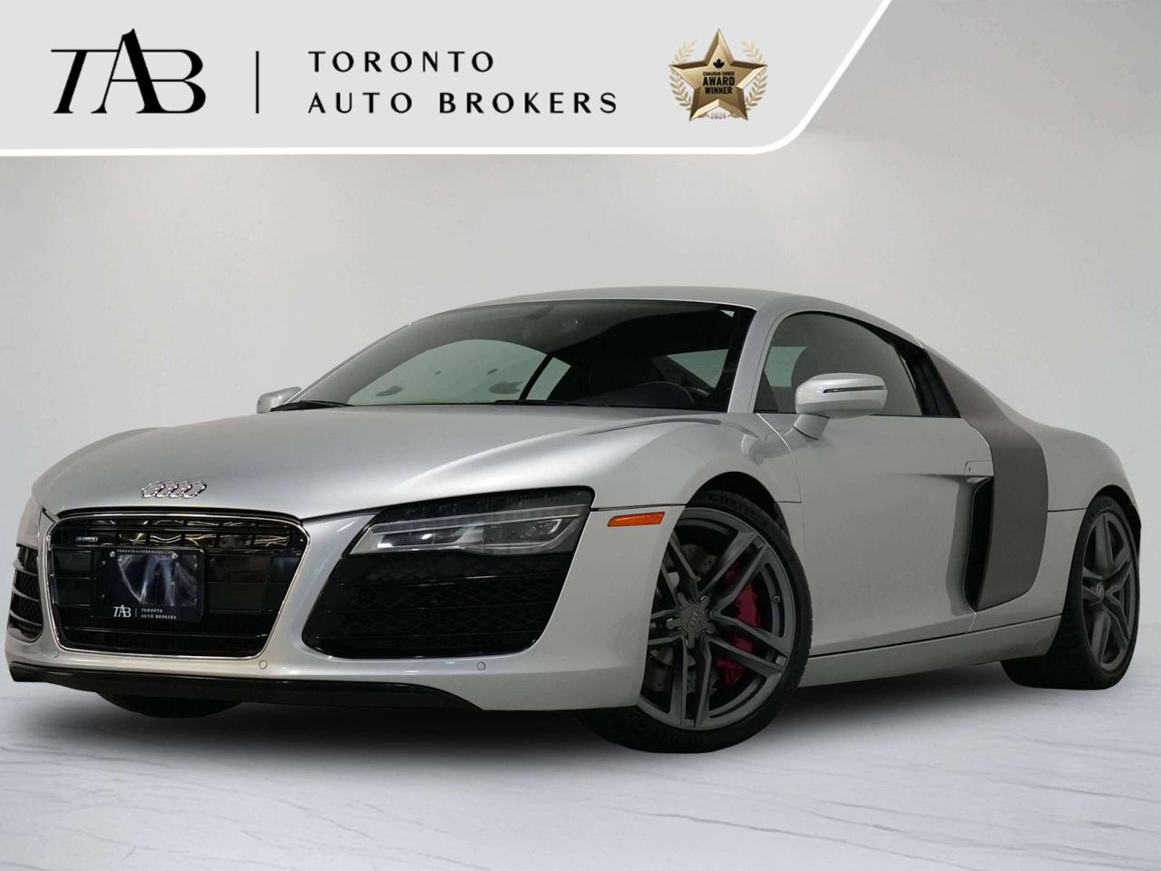This stunning 2014 Audi R8 4.2 is a local Ontario vehicle with a clean CARFAX report, offering an exceptional combination of exotic styling, thrilling performance, and timeless Audi craftsmanship. Powered by a naturally aspirated 4.2L FSI V8 producing 430 horsepower and paired with a highly desirable 6-speed manual transmission, this R8 delivers an engaging and unmistakably raw driving experience. Finished with Audi quattro all-wheel drive and equipped with the premium Bang & Olufsen sound system, this R8 is a true enthusiasts supercar that perfectly blends everyday usability with exotic-car performance. Key features Include: 2PF  Flat-Bottom Multifunction Steering Wheel 6H3  Carbon Sideblade 6NT  Alcantara Headliner with Quilted Stitching 9VK  Bang & Olufsen Sound System PL8  Quilted Full-Leather Upgrade PNC  Navigation Package with AMI PQI  19" 5-Twin-Spoke Titanium-Design Wheels * LED Headlights & LED Taillights * Power Folding & Heated Exterior Mirrors * Automatic Climate Control * Heated 8-Way Power Sport Seats * Leather/Alcantara Sport Interior * Flat-Bottom Leather Steering Wheel * Audi Music Interface * Bluetooth Connectivity * Bang & Olufsen&reg; Premium Sound System * Satellite Radio * Cruise Control * Auto-Dimming Rearview Mirror with Compass * Rain & Light Sensors * Universal Garage Door Opener * Tire Pressure Monitoring System * Audi Drive Select * Quattro Performance All-Wheel Drive NOW OFFERING 3 MONTH DEFERRED FINANCING PAYMENTS ON APPROVED CREDIT.  WE OFFER THE BEST FINANCE RATES, AND DONT CHARGE ANY FINANCING FEE  Looking for a top-rated pre-owned luxury car dealership in the GTA? Look no further than Toronto Auto Brokers (TAB)! Were proud to have won multiple awards, including the 2024 AutoTrader Best Priced Dealer, the 2024 CarGurus Award, the 2025 Top Choice Award, the 2025 Consumer Satisfaction Award, the 2025 Canadian Choice Award, the 2025 Three Best Rated Dealer Award, and many more! With 30 years of experience serving the Greater Toronto Area, TAB is a respected and trusted name in the pre-owned luxury car industry. Our 30,000 sq.Ft indoor showroom is home to a wide range of luxury vehicles from top brands like BMW, Mercedes-Benz, Audi, Porsche, Land Rover, Jaguar, Aston Martin, Bentley, Maserati, and more. And we dont just serve the GTA, were proud to offer our services to all cities in Canada, including Vancouver, Montreal, Calgary, Edmonton, Winnipeg, Saskatchewan, Halifax, and more. At TAB, were committed to providing a no-pressure environment and honest work ethics. As a family-owned and operated business, we treat every customer like family and ensure that every interaction is a positive one. Come experience the TAB Lifestyle at its truest form, luxury car buying has never been more enjoyable and exciting! We offer a variety of services to make your purchase experience as easy and stress-free as possible. From competitive and simple financing and leasing options to extended warranties, aftermarket services, and full history reports on every vehicle, we have everything you need to make an informed decision. We welcome every trade, even if youre just looking to sell your car without buying, and when it comes to financing or leasing, we offer same day approvals, with access to over 50 lenders, including all of the banks in Canada. Feel free to check out your own Equifax credit score without affecting your credit score, simply click on the Equifax tab above and see if you qualify. Call us today or visit our website to learn more about our inventory and services. And remember, all prices exclude applicable taxes and licensing, and vehicles can be certified at an additional cost of $999.