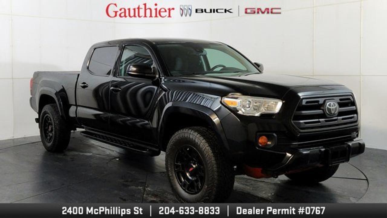 The 2019 Toyota Tacoma SR5 is a capable midsize pickup that combines rugged styling, dependable performance, and everyday versatility. Powered by a 3.5L V6 engine that delivers strong capability, with four-wheel drive and a Multi-Terrain Select system for added confidence when tackling challenging conditions. The SR5 features a comfortable cabin with Toyota Entune Audio, Bluetooth connectivity and a touchscreen display. Safety is enhanced by Toyota Safety Sense P, which includes features such as Pre-Collision System with Pedestrian Detection, Lane Departure Alert, and Automatic High Beams. With its durable construction, off-road capability, practical truck bed, and proven reputation for reliability, the 2019 Toyota Tacoma SR5 is an excellent choice for drivers seeking a versatile midsize pickup.