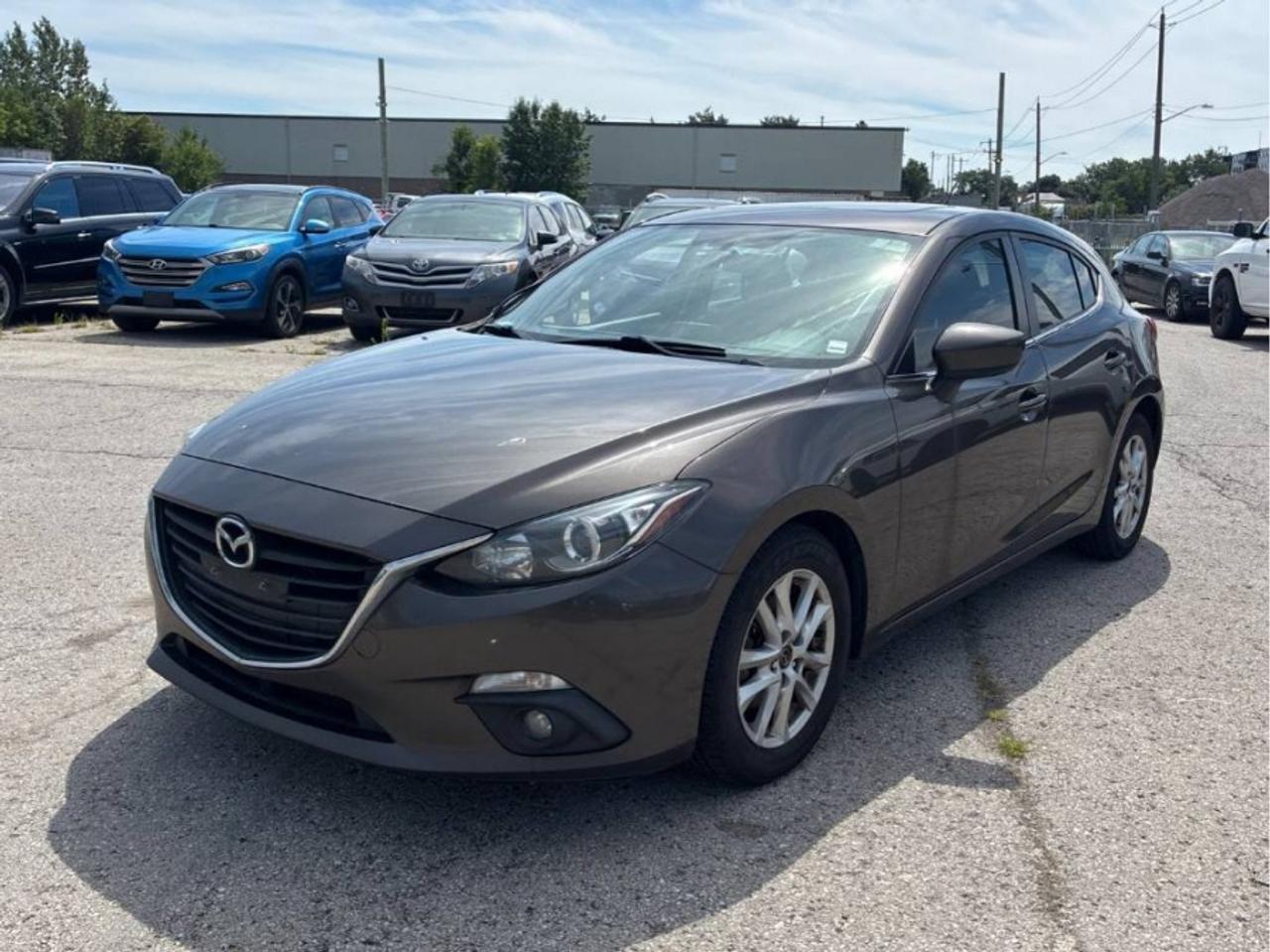 2015 MAZDA MAZDA3 GS SKYACTIV<br>FULLY CERTIFIED WITH WARRANTY<br><br>WAS $5990 | NOW $4990<br>343,000 KM | STK#10318<br><br>ABOUT THIS VEHICLE<br><br>This 2015 MAZDA MAZDA3 GS SKYACTIV is equipped with:<br><br>* Automatic Transmission<br>* Hatchback<br>* Sunroof<br>* Heated Seats<br>* Bluetooth<br>* Reverse Camera<br>* Alloy Wheels<br>* Power Windows<br>* Power Locks<br>* Power Mirrors<br>* Air Conditioning<br><br>WHATS INCLUDED?<br><br>FULL SAFETY CERTIFICATION<br>Every vehicle at First Choice Motors is sold fully certified at no extra charge.<br><br>BRAND NEW BRAKES<br>Brand new brake rotors and pads are included with every vehicle purchase.<br><br>36-DAY WARRANTY<br>Every vehicle includes a 36-day warranty on all safety-related items.<br><br>EXTENDED WARRANTY AVAILABLE<br>Additional protection plans are available for up to 5 years.<br><br>FINANCING AVAILABLE<br><br>We work with a wide range of credit situations, including:<br><br>* Good Credit<br>* Bad Credit<br>* No Credit<br>* Students<br>* Newcomers to Canada<br><br>Financing available O.A.C.<br><br>SHOP YOUR WAY<br><br>* Shop In Person<br>* 100% Online Purchase Available<br>* FREE Delivery Across Ontario<br><br>WHY FIRST CHOICE MOTORS?<br><br>First Choice Motors specializes in affordable cars, SUVs and vans, with 300  vehicles in stock and a large selection priced between $5,000 and $15,000.<br><br>Our goal is simple: affordable vehicles, transparent pricing and an easy car-buying experience.<br><br>PRICE & FEES<br><br>Advertised price INCLUDES the $22 OMVIC transaction fee.<br><br>Additional Charges:<br><br>* 13% HST<br>* Licence Plates <br>* Ownership Registration<br><br>NO ADDITIONAL CERTIFICATION FEE.<br><br>No credit card payments can be accepted for vehicle purchases.