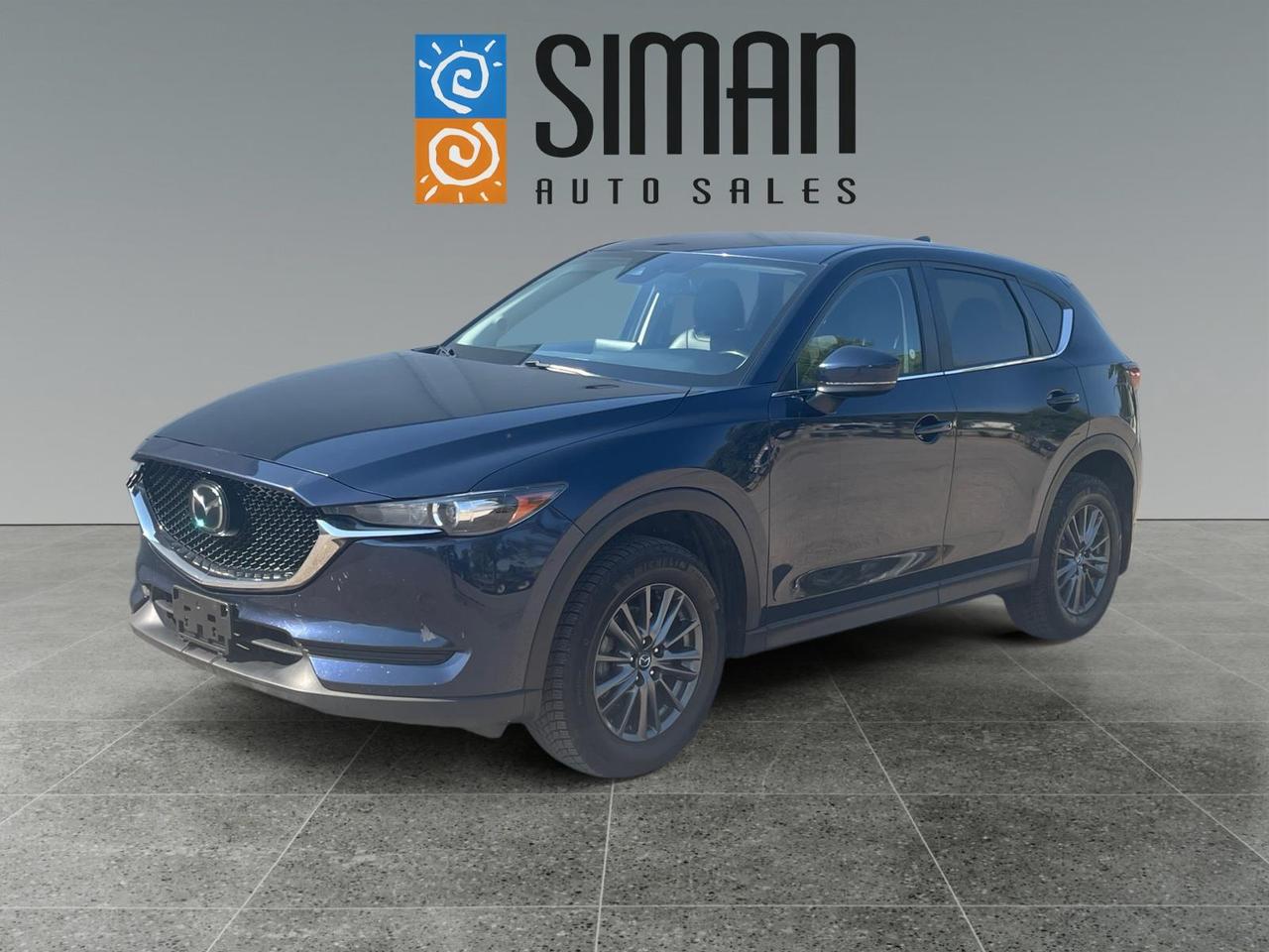 **Looking for a stylish, comfortable, and well-equipped SUV thats perfect for Saskatchewan driving?** Check out this **2021 Mazda CX-5 GS AWD** with **119,800 km**! This **accident-free** CX-5 offers an excellent combination of sporty handling, premium comfort, advanced safety technology, and everyday practicality.

Inside, youll find **power heated leather/suede seating**, a **heated steering wheel**, and plenty of premium touches to make every drive comfortable. The **power liftgate** adds convenience, while the **alloy wheels** give this CX-5 a sharp, upscale appearance.

Its loaded with desirable technology and safety features including **distance-pacing cruise control, Lane Keep Assist, Blind Spot Monitoring, Bluetooth connectivity, SiriusXM satellite radio, and an auto-dimming rearview mirror**.

### Professionally Serviced & Ready to Go!

This Mazda has been thoroughly prepared for its next owner with:

* **Presale inspection completed**
* **Fresh full synthetic oil service**
* **New engine and cabin air filters**
* **New brakes all around  pads and rotors**
* **Accident-free history**

You can buy with confidence knowing the major maintenance and brake work has already been taken care of.

**Easy financing available on-site through 16 banks and lenders.** Trades encouraged  we offer top value for your trade. **Aftermarket warranties available** to fit every need and budget.

**Siman Auto Sales  large enough to make a difference, small enough to care. Serving Saskatchewan for over 28 years. Check our reviews!**

**Over 70 vehicles to choose from. Visit us today and take this beautiful Mazda CX-5 for a test drive!**