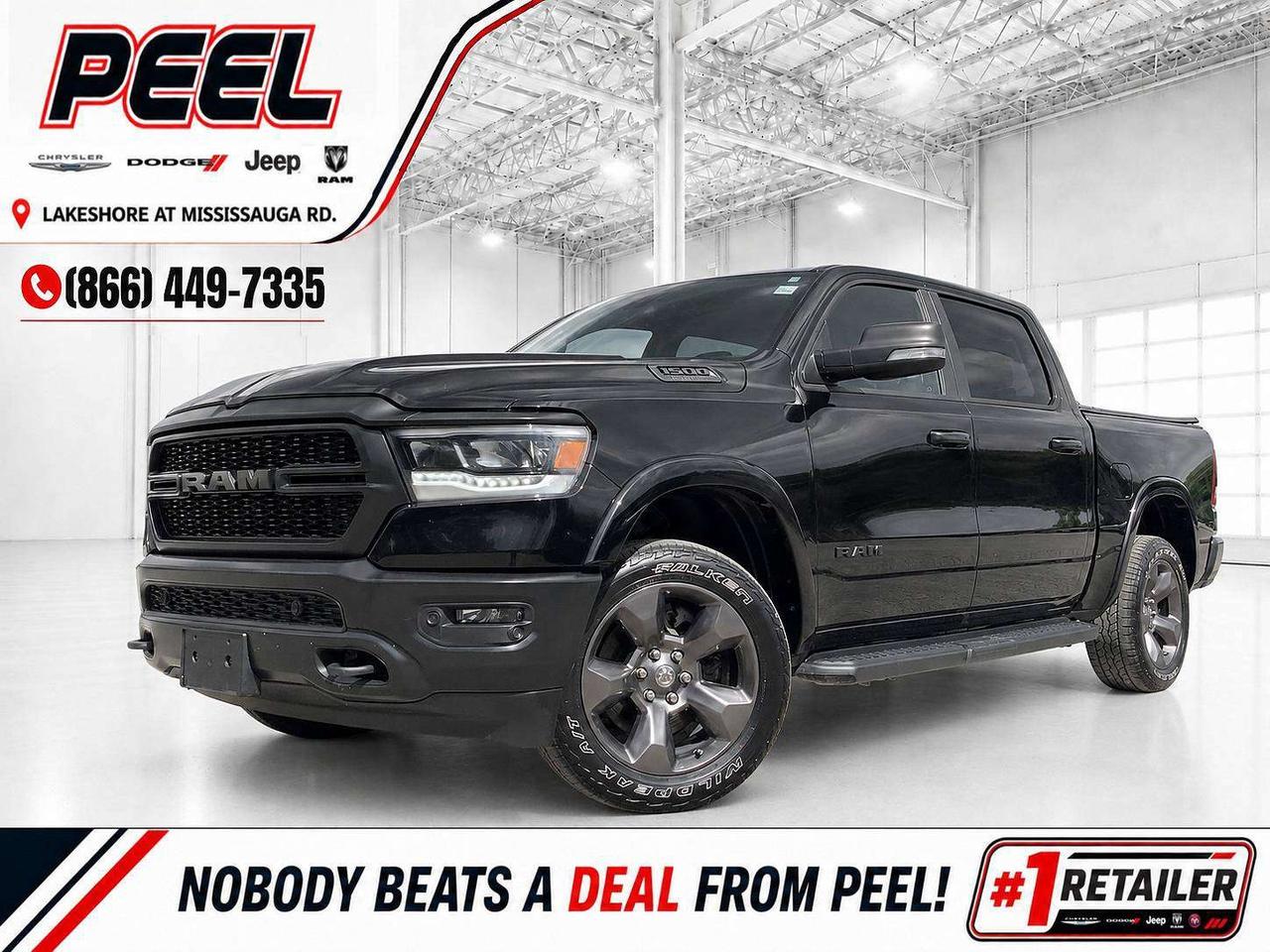 COME SEE WHY NOBODY BEATS A DEAL FROM PEEL! Your Source for ALL make and models used cars and trucks. 2022 Ram 1500 Big Horn Built to Serve Crew Cab 4X4 | 5.7L HEMI V8 | Diamond Black Crystal Pearl | Black Performance Cloth & Premium Vinyl Sport Seats | Orange Accent Stitching | Heated Front Seats | Heated Steering Wheel | Remote Start | Uconnect 5 NAV 8.4-Inch Touchscreen | Apple CarPlay & Android Auto | Alpine 9-Speaker Premium Audio System with Subwoofer | 7-Inch Digital Driver Display | Dual-Zone Automatic Climate Control | Power Driver Seat with Lumbar Support | Power Adjustable Pedals | Rear Power Sliding Window | Park-Sense Front & Rear Parking Sensors | Rear Back-Up Camera | Built to Serve Instrument-Panel Badge | Customizable Velcro Front-Seat Panels | MOLLE Seatback Storage | Black Onyx Chrome Interior Trim | Electronic Locking Rear Axle | Heavy-Duty Off-Road-Calibrated Shocks | Raised Ride Height | Hill Descent Control | All-Terrain Tires | Fuel Tank, Transfer Case, Front Suspension & Steering Skid Plates | Tow Hooks | Class IV Hitch Receiver | Black Tubular Side Steps | 20-Inch Technical Grey Aluminum Wheels | Black Grille, Bumpers, Badging & Door Handles | Built to Serve & Flag Decals | Soft Tonneau Cover | 124.9L Fuel Tank This 2022 Ram 1500 Built to Serve is one of the most distinctive and meaningful special-edition Rams produced. Finished in Diamond Black Crystal Pearl, this firefighter-inspired edition honours the men and women who serve their communities, with orange accent stitching, unique Built to Serve and flag decals, a special instrument-panel badge, customizable Velcro patch panels, and MOLLE webbing on the front seatbacks. Its black grille, bumpers, badging, door handles, side steps, and 20-inch Technical Grey wheels create an aggressive blacked-out appearance that immediately separates it from an ordinary Big Horn. The Built to Serve package is far more than an appearance upgrade. Its 5.7L HEMI V8 is backed by an electronic-locking rear axle, raised ride height, heavy-duty off-road-calibrated shocks, all-terrain tires, hill descent control, tow hooks, and protective skid plates for the fuel tank, transfer case, front suspension, and steering gear. The Big Horn Level 2 Equipment Group adds heated seats, a heated steering wheel, remote start, dual-zone climate control, power-adjustable pedals, front and rear parking sensors, and a rear power-sliding window. Uconnect 5 navigation, Apple CarPlay, Android Auto, Alpine premium audio, a Class IV hitch, large 124.9L fuel tank, and the added soft tonneau cover make it equally ready for daily driving, towing, winter weather, and weekends away. This is a rare HEMI-powered Ram with authentic off-road capability, limited-edition character, and a story behind every detail. ______________________________________________________ FREE CarFax included! Click the CarFax link in the listing to view the report. Our advertised prices are for consumers/end users only and are not intended for dealer, wholesale, exporter, or broker purchases. ______________________________________________________ Peel Chrysler is based in Port Credit, Mississauga, and proudly serves customers across Ontario and Canada, including Toronto, Oakville, North York, Richmond Hill, Ajax, Hamilton, Niagara Falls, Brampton, Scarborough, Vaughan, London, Windsor, Cambridge, Kitchener, Waterloo, Brantford, Sarnia, Pickering, Huntsville, Milton, Woodbridge, Aurora, Newmarket, Orangeville, Georgetown, Markham, North Bay, Sudbury, Barrie, Oshawa, Kingston, Innisfil, and surrounding areas. Browse our selection of used cars, trucks, SUVs, vans, Ram, Jeep, Dodge, Chrysler, FIAT, and all makes and models at peelchrysler.com. ______________________________________________________ Disclaimer: Prices are for consumer/end-user purchases only. Advertised prices are all-in and include all dealer fees and charges, including the $599 loan processing fee where applicable, except HST, Fuel and Licensing, unless otherwise stated. Payments, rates, and terms are subject to approved credit and may change without notice. If a trade-in has an outstanding loan balance and Peel Chrysler is required to facilitate the lien payout, a $349 lien payout fee applies. Most pre-owned vehicles originally come with two keys; however, all Peel Chrysler pre-owned vehicles come standard with one key unless otherwise stated. Vehicle images may be digitally adjusted or enhanced for presentation purposes and may not always reflect the exact appearance of the vehicle. While we make every effort to ensure accuracy, vehicle details, features, options, materials, history, specifications, pricing, availability, and CarFax information should be verified with Peel Chrysler before purchase.