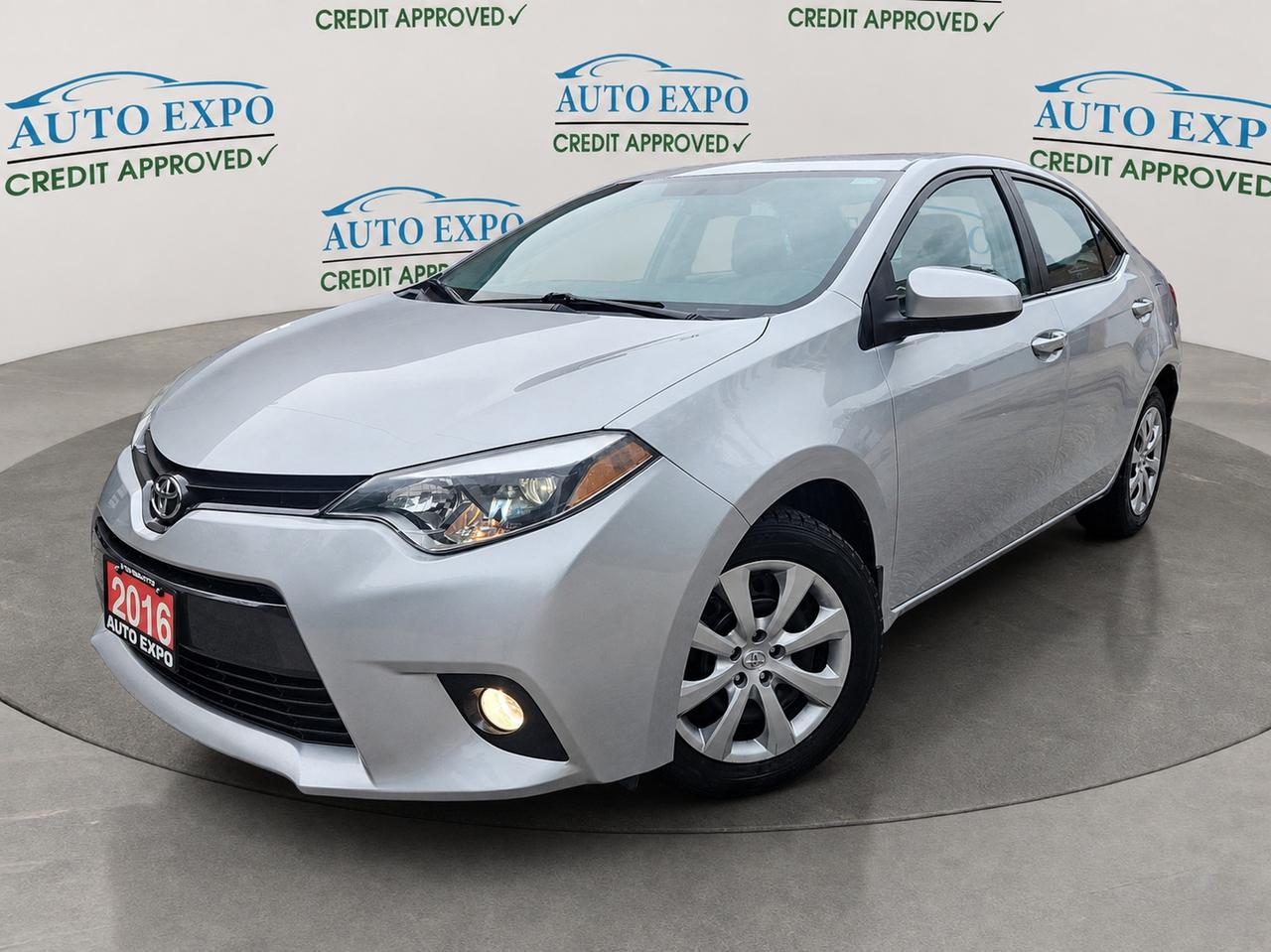 <p>Looking for a reliable and feature-packed sedan that wont break the bank? Auto Expo Inc. has the perfect pre-owned vehicle for you: a stunning silver 2016 Toyota Corolla LE. This well-maintained sedan offers the renowned durability and fuel efficiency Toyota is known for, making it an excellent choice for daily commutes, weekend adventures, and everything in between. Step inside and youll find a comfortable gray interior designed for driver and passenger enjoyment, all wrapped up in a classic sedan body style. With only 178,000 kilometers on the odometer, this Corolla is ready for many more miles of dependable service.</p><p>This 2016 Toyota Corolla LE is more than just a way to get around; its a smart investment in your daily drive. The automatic transmission ensures a smooth and effortless driving experience, while the front-wheel drive provides confident handling in various conditions. Powered by a gasoline engine, this sedan offers a balanced blend of performance and economy. The sleek silver exterior is sure to turn heads, and the practical 4-door design makes it easy for everyone to hop in and out.</p><p>Here are 5 features that make this 2016 Toyota Corolla LE at Auto Expo Inc. a real winner:</p><ul><li><strong>Certified Pre-Owned Peace of Mind:</strong> Drive with confidence knowing this Corolla has undergone a rigorous inspection and meets Auto Expo Inc.s high standards for quality.</li><li><strong>Sunroof for Open-Air Enjoyment:</strong> Let the sunshine in or enjoy a starry night with the convenient sunroof, adding a touch of luxury to your drives.</li><li><strong>Apple CarPlay Integration:</strong> Seamlessly connect your iPhone to access your favorite apps, music, and navigation directly through the cars infotainment system for ultimate convenience.</li><li><strong>Fog Lights for Enhanced Visibility:</strong> Cut through inclement weather and see more clearly with the stylish and functional fog lights, improving safety during challenging driving conditions.</li><li><strong>Smooth and Efficient Variable Transmission:</strong> Experience a fluid and responsive ride thanks to the advanced Variable Transmission (CVT) that optimizes engine performance for both power and fuel economy.</li></ul><p><strong><em>Powered by AutoIntelligence&trade;</em></strong></p><p>Vehicle information has been generated using artificial intelligence and is provided for informational purposes only. While efforts are made to ensure accuracy, please confirm all details directly with the dealer.</p>