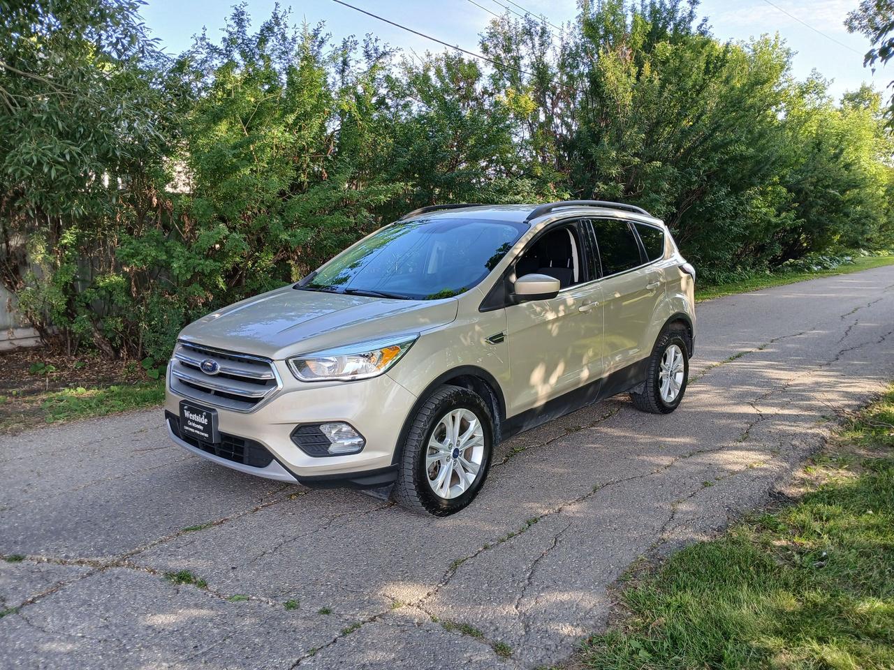 <p><a name=_Hlk203474066></a>Drives Like New!!! 2018 Ford Escape <span style=mso-spacerun: yes;>&nbsp;</span>All Wheel drive, <span style=mso-spacerun: yes;>&nbsp;</span>This SUV has lots of great features, Blue Tooth, Reverse camera, air conditioning, tilt steering, power windows, power door locks, mirrors, rear folding seats.&nbsp;All <span style=mso-spacerun: yes;>&nbsp;</span>features designed to enhance your driving experience . This SUV has a fantastic service history and no major accidents. Well cared for with almost new tires! safety certified, $12,950. plus taxes. Car fax is available on our website. Call today to set up an appointment to view and test drive. Westside Sales Ltd.<span style=mso-spacerun: yes;>&nbsp; </span>1461 Waverley Street 204 488 3793. Buy with confidence, We are one of the most established used car dealerships in Winnipeg. Come check us out... theres a reason we have been around since 1985 at the same location.<span style=mso-spacerun: yes;>&nbsp;&nbsp;&nbsp; </span>See our other great deals at WWW.Westsidesales.CA Apply for financing on our website.<span style=mso-spacerun: yes;>&nbsp; </span>Check us out on facebook and instagram @westsidesale<span style=mso-spacerun: yes;>&nbsp;&nbsp; </span>DP#9491</p>