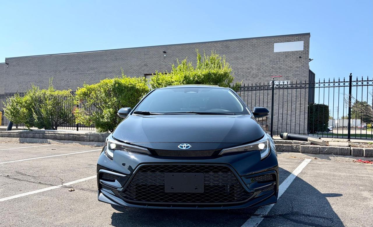 <div class=vehicle-description-wrapper><div class=vdp-description prose><p><strong>2025 TOYOTA COROLLA LE HYBRID AWD </strong>, KEYLESS ENTRY, HEATED SEATS, LED HEADLIGHTS, BLIND SPOT MONITOR, LANE DEPARTURE WARNING, APPLE CARPLAY / ANDROID AUTO, CLEAN CARFAX AND MUCH MORE</p><p><strong>HST and Licensing will be extra**</strong></p><p><strong>&bull; On Financed Deals:&nbsp;</strong>We must call this a &ldquo;Finance Fee&rdquo;. It will be a separate line item on the documentation. This fee has already been included in any payment quote advertised by Noble Auto Hut. Our&nbsp;<strong><em>Finance Fee</em></strong>&nbsp;is&nbsp;<strong><em>$999.</em></strong></p><p>&bull; Vehicles sold at Noble Auto Hut are&nbsp;<strong>sold &ldquo;As-Is&rdquo;&nbsp;</strong>and are subject to an optional&nbsp;<strong>Safety Inspection Fee of $799.&nbsp;<em>This vehicle is being sold &ldquo;as-is&rdquo;, unfit, not e-tested and is not represented as being in a road worthy condition, mechanically sound or maintained at any guaranteed level of quality. The vehicle may not be fit for use as a means of transportation and may require substantial repairs at the purchaser&rsquo;s expense. It may not be possible to register the vehicle to be driven in its current condition.</em></strong></p><p><strong>OMVIC FEE&nbsp;</strong></p><p>Ontario Motor Vehicle Industry Council&nbsp;<strong>charges each person in Ontario $22 when they make a vehicle purchase.</strong>&nbsp;</p><p><strong>Licensing Fee&nbsp;</strong></p><p>Noble Auto Hut will facilitate the registration of your new vehicle with Service Ontario. We simply ask to be reimbursed for the cost of registration. This is a common practice when purchasing a vehicle.&nbsp;<strong>$32&nbsp;</strong>to attach your existing license plates to your new vehicle.&nbsp;<strong>$59&nbsp;</strong>to purchase and register new license plates to your new vehicle. Heavy-duty and Commercial Vehicles have varying costs of registration depending on weight and usage.</p><p><strong>Noble Auto Hut Inclusions Explained</strong></p><p><strong>Safety Inspection&nbsp;</strong>Noble Auto Hut will perform an Ontario Safety Standards Inspection on each vehicle at time of sale. Any repairs required to meet Ontario Safety Standards will be done. Noble Auto Hut will provide this service for an&nbsp;<strong><u>optional</u>&nbsp;fee of $799</strong>.&nbsp;</p><p><strong>On Cash Deals:&nbsp;</strong>We must call this a &ldquo;Cash Purchase Surcharge&rdquo;. It will be added to the selling price of the vehicle on the documentation.&nbsp;Our&nbsp;<strong><em>Cash Purchase Surcharge</em></strong>&nbsp;is&nbsp;<strong><em>$999.</em></strong></p><p><strong>Keys:&nbsp;</strong>Noble Auto Hut guarantees at least 1 operational key with each vehicle. In the case that a client would like additional keys, they will be made available at our industry wholesale pricing.</p><p><strong>Vehicle History:</strong>&nbsp;CarFax Vehicle History Reports are readily available when requested. We are happy to provide clients with everything required for them to make an informed decision.</p><p><strong>Fuel & Detail:&nbsp;</strong>Each vehicle will be delivered to its new owner with at least half a tank of fuel and will be fully detailed prior to the client taking delivery.</p><p><strong>15 Hale Rd&nbsp;</strong><strong>Brampton&nbsp;</strong>Come in for a test drive and speak to our sales staff, who will look after all your automotive needs with a friendly, low-pressure approach. Get approved and drive away in your new ride today!</p><p>FINANCING AVAILABLE AT AS LOW AS 6.99% O.A.C</p><p>WE WELCOME EVERYONE-GOOD/BAD CREDIT, NEWCOMERS, STUDENTS. EVERYONE IS APPROVED.</p><p>PREVIOUSLY DECLINED BY BANK ? NO PROBLEM&nbsp;</p><p>LET THE EXPERIENCED PROFESSIONALS HANDLE YOUR CREDIT APPLICATION.&nbsp;</p><p>APPLY FOR PRE-APPROVAL TODAY!!</p><h4>Warranty</h4><p>36 DAY/1000 KMS WARRANTY ON SAFETY ITEMS.</p><p><strong>EXTENDED WARRANTY AND GAP INSURANCES ARE AVAILABLE ON REQUEST</strong></p></div></div><div class=dsp-collapse vdp-collapse p-8 flex flex-col border-t>&nbsp;</div>