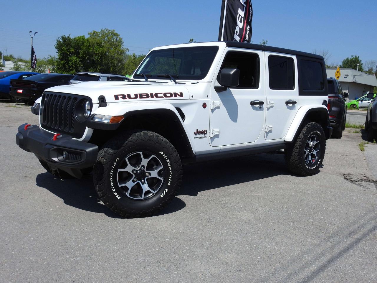 Clean Carfax. One owner local trade. We sold it new. 6 Speed Manual. Heated Leather buckets. Navigation, Rear view camera, Alpine audio, Factory Trailer tow Group with hitch, 3 piece Hardtop, Satellite radio, Apple Carplay, Aux switches, body colour fender flares, BFG tires, Black grill, auto climate control, Only HST extra.