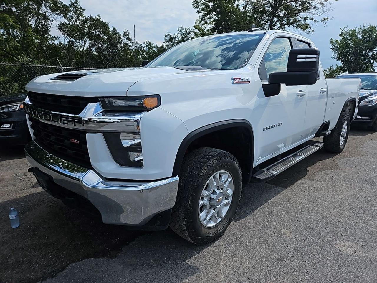 2023 Chevrolet Silverado 2500HD LT Double Cab 4x4 with the long box. Powered by the 6.6L V8 gas engine with automatic transmission and four-wheel drive, finished in Summit White with Jet Black cloth. Equipped with back-up camera, bed liner, running boards, keyless entry, heated mirrors, Bluetooth, auxiliary audio input, satellite radio, factory privacy glass, built-in WiFi hotspot and telematics. 246,263 km. Stock 116484. Low interest financing available. Trades welcome. Call Patterson Auto Sales in Madoc to book a test drive.