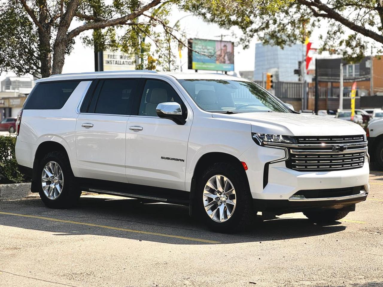 NO ACCIDENTS | 2023 Chevrolet Suburban Premier 4WD - 5.3L V8 | Leather | Heated & Cooled Seats | Bose | 7-Passenger | For Sale in Saskatoon, SK

VIN: 1GNSKFKD9PR201009
Mileage: 99,314 KM
Exterior Color: Summit White
Interior: Premium Brown Leather
Trim: Premier 4WD
Body Style: Full-Size Luxury SUV
Engine: 5.3L EcoTec3 V8 Gasoline
Horsepower: 355 HP
Torque: 383 lb-ft
Transmission: 10-Speed Automatic
Drivetrain: 4-Wheel Drive
Condition: NO ACCIDENTS | PREMIER | 4WD | V8

2023 Chevrolet Suburban Premier 4WD for Sale in Saskatoon, Saskatchewan

Looking for a 2023 Chevrolet Suburban Premier 4WD for sale in Saskatoon, Saskatchewan? This No Accident Chevrolet Suburban Premier delivers the space of a full-size three-row SUV with premium luxury, V8 performance, true 4WD capability, advanced Chevrolet safety technology, and exceptional passenger and cargo versatility.

Finished in classic Summit White with a beautiful Premium Brown Leather Interior, this 2023 Suburban Premier has 99,314 KM and offers one of the most desirable combinations available in Chevrolets full-size SUV lineup.

Power comes from the proven 5.3L EcoTec3 V8, producing 355 horsepower and 383 lb-ft of torque, paired with a smooth 10-speed automatic transmission and 4-wheel drive. This VIN configuration identifies the L84 5.3L V8 with Direct Injection and Dynamic Fuel Management.

The Suburban Premier takes comfort substantially beyond a basic family SUV with features including heated and ventilated leather front seats, heated second-row seating, heated steering wheel, Bose 10-speaker surround sound, Magnetic Ride Control, wireless smartphone integration, wireless charging, power-folding third-row seating, tri-zone climate control, and a hands-free power liftgate.

Available now at Platinum Auto Sport in Saskatoon, this Suburban is an outstanding option for families, business owners, highway travellers, and buyers searching for a premium three-row 4WD SUV in Saskatchewan.

5.3L EcoTec3 V8 - 355 HP

This Suburban is powered by Chevrolets 5.3L EcoTec3 V8 gasoline engine, delivering the smooth power and low-end torque expected from a full-size Chevrolet SUV.

Performance & Mechanical Features
5.3L EcoTec3 V8 Gasoline Engine
355 Horsepower
383 lb-ft of Torque
Direct Fuel Injection
Dynamic Fuel Management
Variable Valve Timing
10-Speed Automatic Transmission
Electronic Transmission Selection
4-Wheel Drive
AutoTrac® 4WD System
Electronic Transfer Case
Tow/Haul Mode
Traction Select System
Hill Start Assist
Hill Descent Control
StabiliTrak® Electronic Stability Control
Traction Control
Four-Wheel Anti-Lock Disc Brakes
Electric Power Steering
Independent Front Suspension
Independent Multi-Link Rear Suspension
Trailer Sway Control

The 5.3L V8 is Chevrolets standard gasoline engine for the Premier and is paired with the 10-speed automatic transmission.

Magnetic Ride Control

One of the biggest upgrades found on the Premier trim is Chevrolets sophisticated Magnetic Ride Control suspension.

Magnetic Ride Control Benefits
Electronically Controlled Dampers
Continuously Monitors Road Conditions
Automatically Adjusts Suspension Damping
Improved Highway Ride Quality
Better Body Control
Improved Cornering Stability
Smoother Ride Over Uneven Roads
Premium Full-Size SUV Driving Experience

Magnetic Ride Control is standard equipment on the Suburban Premier, helping give this large SUV a significantly more refined ride than a conventional truck-based suspension.

Chevrolet 4WD Capability

This Suburbans 4-wheel-drive system provides the added traction Saskatchewan drivers want during winter.

4WD & Traction Features
Four-Wheel Drive
Electronic 4WD Selection
Auto 4WD Capability
Traction Select System
Tow/Haul Mode
Hill Start Assist
Hill Descent Control
StabiliTrak®
Traction Control
Trailer Sway Control
Excellent Snow & Ice Capability

Whether youre travelling through Saskatoon after a winter storm, driving Saskatchewan highways, towing, heading to the lake, or travelling with the family, the Suburban offers confident year-round capability.

Premier Luxury Leather Interior

The Premier sits near the top of the Suburban lineup and adds a substantial collection of luxury and convenience equipment.

This example features a distinctive Premium Brown Leather Interior that contrasts beautifully with its Summit White exterior.

Premier Interior Features
Premium Brown Leather Seating
Perforated Leather-Appointed Front Seats
Heated Front Seats
Ventilated / Cooled Front Seats
Heated Second-Row Outboard Seats
Power Driver Seat
Power Front Passenger Seat
Power Lumbar Adjustment
Driver Memory Settings
Heated Leather-Wrapped Steering Wheel
Power Tilt & Telescopic Steering Column
Tri-Zone Automatic Climate Control
Separate Rear Climate Controls
Rear Passenger Air Vents
Remote Vehicle Start
Keyless Open
Push Button Start
Power Windows
Power Door Locks
Auto-Dimming Rearview Mirror
Universal Home Remote
Multiple USB Charging Ports
Multiple Cupholders
Large Front Centre Console
Premium Interior Trim

Heated and ventilated front leather seats are standard Premier equipment, along with driver memory and premium power seating.

Three-Row Family Seating

One of the biggest reasons buyers choose a Suburban is its combination of three-row passenger room and full-size cargo capacity.

Passenger & Seating Features
Three Rows of Seating
Second-Row Captains Chairs
Heated Second-Row Outboard Seats
Power Second-Row Seat Release
Power-Folding Third-Row Seat
60/40 Split Third-Row Seating
Large Third-Row Passenger Area
Rear Climate Controls
Rear Passenger Air Vents
Easy Third-Row Access
Multiple Rear USB Charging Ports
Child Seat LATCH Anchors

Unlike many midsize three-row SUVs, the Suburban provides genuine adult-friendly third-row seating while still maintaining usable cargo space behind it.

Huge Suburban Cargo Capacity

The Suburbans extended-length body provides significantly more cargo room than the shorter Chevrolet Tahoe.

Cargo & Utility Features
Extended-Length Suburban Body
Large Cargo Area Behind Third Row
Power-Folding Third Row
Foldable Second-Row Seating
Flat-Load Cargo Configuration
Hands-Free Power Programmable Liftgate
Power Liftgate Height Adjustment
Rear Cargo Tie-Downs
Underfloor Storage
Roof-Mounted Luggage Capability
Excellent Family & Travel Versatility

With the seats folded, the Suburban becomes exceptionally useful for luggage, hockey equipment, strollers, work equipment, pets, camping gear, and long-distance family travel.

Chevrolet Infotainment 3 Premium with Google Built-In

The 2023 Suburban Premier features Chevrolets premium infotainment platform.

Technology & Connectivity
10.2-Inch HD Colour Touchscreen
Chevrolet Infotainment 3 Premium
Google Built-In
Google Maps Integration
Google Assistant
Google Play Capability
Wireless Apple CarPlay®
Wireless Android Auto
Bluetooth® Hands-Free Calling
Bluetooth® Audio Streaming
SiriusXM® with 360L Capability
Wireless Smartphone Charging
Multiple USB Ports
USB-C Charging Ports
Steering Wheel Audio Controls
Voice Recognition
Chevrolet Connected Services Capability
OnStar® Capability
Wi-Fi Hotspot Capability
Digital Driver Information Display

Chevrolet introduced Google built-in and the larger configurable digital driver display as standard equipment on LT trims and above in this generation.

Bose® 10-Speaker Premium Surround Sound

The Premier trim upgrades the Suburbans audio experience with a premium Bose surround sound system.

Bose Audio Features
Bose® 10-Speaker Surround Sound
Bose CenterPoint® Technology
Premium Amplified Audio
Dedicated Subwoofer
SiriusXM® Capability
Bluetooth® Audio Streaming
Wireless Apple CarPlay®
Wireless Android Auto
Steering Wheel Audio Controls

The 10-speaker Bose CenterPoint system is standard equipment on the Premier.

12.3-Inch Digital Driver Display

The modern Suburban cockpit includes a large configurable driver information display.

Driver Technology
12.3-Inch Configurable Digital Instrument Cluster
Digital Speedometer
Trip Information
Fuel Economy Information
Driver Assistance Information
Navigation Information Integration
Vehicle Status Information
Steering Wheel Controls

The 12.3-inch digital driver display became standard on LT and higher trims, including Premier.

Chevy Safety Assist

The 2023 Chevrolet Suburban incorporates a comprehensive suite of active safety technology.

Chevy Safety Assist Features
Automatic Emergency Braking
Front Pedestrian Braking
Forward Collision Alert
Lane Keep Assist with Lane Departure Warning
Following Distance Indicator
IntelliBeam® Automatic High Beams
Front & Rear Park Assist
Lane Change Alert
Side Blind Zone Alert
Rear Cross Traffic Alert
Safety Alert Seat
HD Rear Vision Camera
Tire Pressure Monitoring System
StabiliTrak® Stability Control
Traction Control
Four-Wheel ABS
Advanced Airbag System
Teen Driver Technology
Buckle to Drive
LATCH Child Seat Anchors

Blind-spot monitoring and Rear Cross Traffic Alert are identified as standard equipment for this Premier VIN configuration.

Additional Available Premier Technology - Where Equipped

Depending on the vehicles original factory packages, Premier models could also be equipped with:

Adaptive Cruise Control
HD Surround Vision
Rear Camera Mirror
Head-Up Display
Rear Pedestrian Alert
Reverse Automatic Braking
Super Cruise Hands-Free Driving Technology
Enhanced Trailering Technology

These items were package-dependent on the 2023 Premier and should only be advertised as equipped after confirming them physically or from the original build sheet.

Summit White Exterior

The Summit White finish gives this Suburban a clean, premium appearance that works especially well with the contrasting brown leather cabin.

Exterior Features
Summit White Exterior
20-Inch Polished Aluminum Wheels
LED Headlights
LED Daytime Running Lights
LED Taillights
IntelliBeam Automatic High Beams
Automatic Headlights
Heated Power-Folding Exterior Mirrors
Integrated Mirror Turn Signals
Memory Exterior Mirrors
Rain-Sensing Windshield Wipers
Deep-Tinted Rear Privacy Glass
Roof Rails
Hands-Free Power Liftgate
Rear Window Wiper
Full-Size SUV Styling
Chevrolet Signature Front Grille
Premium Comfort for Saskatchewan Winters

This Suburban is particularly well equipped for Saskatchewans climate.

Cold Weather Comfort
Heated Front Seats
Heated Second-Row Seats
Heated Steering Wheel
Remote Start
Tri-Zone Automatic Climate Control
Heated Exterior Mirrors
Automatic Climate Control
4-Wheel Drive
Traction Control
Stability Control

And during Saskatchewan summers, the ventilated front seats help keep the driver and front passenger comfortable.

Why Buy This 2023 Chevrolet Suburban Premier 4WD?
NO ACCIDENT HISTORY
PREMIER LUXURY TRIM
99,314 KM
Summit White Exterior
Premium Brown Leather Interior
5.3L EcoTec3 V8
355 Horsepower
383 lb-ft Torque
10-Speed Automatic
4-Wheel Drive
Magnetic Ride Control
Three-Row Seating
Second-Row Captains Chairs
Heated Front Seats
Ventilated Front Seats
Heated Second-Row Seats
Heated Steering Wheel
Driver Memory
Power Front Seats
Power-Folding Third Row
Tri-Zone Automatic Climate Control
Bose® 10-Speaker Surround Sound
10.2-Inch HD Touchscreen
Google Built-In
Wireless Apple CarPlay®
Wireless Android Auto
Wireless Phone Charging
Digital Instrument Cluster
Remote Start
Hands-Free Power Liftgate
Blind Spot Monitoring
Rear Cross Traffic Alert
Front & Rear Parking Sensors
Lane Keep Assist
Automatic Emergency Braking
Forward Collision Alert
Automatic High Beams
Massive Passenger & Cargo Capacity
Excellent Saskatchewan Winter Capability
Excellent Family, Highway & Travel SUV
Google VLA-Friendly Vehicle Information

Year: 2023
Make: Chevrolet
Model: Suburban
Trim: Premier
Body Style: Full-Size SUV
Doors: 4
Engine: 5.3L EcoTec3 V8 Gasoline
Engine Code: L84
Cylinders: 8
Horsepower: 355 HP
Torque: 383 lb-ft
Transmission: 10-Speed Automatic
Drivetrain: 4WD / Four-Wheel Drive
Fuel Type: Gasoline
Mileage: 99,314 KM
Exterior Color: Summit White
Interior Color: Brown
Interior Material: Premium Leather
Seating: Three-Row Passenger SUV
VIN: 1GNSKFKD9PR201009
Accident History: No Accidents
Location: Saskatoon, Saskatchewan
Dealer: Platinum Auto Sport

Chevrolet Suburban Financing at Platinum Auto Sport Saskatoon

At Platinum Auto Sport in Saskatoon, we specialize in helping customers explore automotive financing solutions for all types of credit throughout Saskatchewan.

Our finance department works with multiple Canadian banks and automotive lenders to help find financing options based on each customers individual credit history, income, budget, down payment, and vehicle selection.

Financing Options for All Types of Credit
Excellent Credit
Good Credit
Bad Credit
Poor Credit
No Credit
Credit Rebuilding
First-Time Buyers
New to Canada
Self-Employed Customers
Previous Bankruptcy
Consumer Proposal
Previous Credit Challenges
Trade-Ins Welcome

Whether youre searching for Chevrolet Suburban financing in Saskatoon, bad credit SUV financing in Saskatchewan, used vehicle financing Saskatoon, large family SUV financing, first-time buyer auto financing, or new-to-Canada vehicle financing, Platinum Auto Sport can help you explore available options.

All financing is subject to lender approval and applicable terms and conditions.

In-House Financing Dealer in Saskatoon, Saskatchewan

Searching online for an in-house financing dealership in Saskatoon, bad credit car dealership Saskatchewan, used SUV financing Saskatoon, credit rebuilding auto financing, no credit vehicle financing, or new-to-Canada car financing?

Platinum Auto Sport works with customers from a wide variety of credit backgrounds and multiple Canadian automotive lenders.

Our goal is to provide a straightforward vehicle purchase and financing process while helping Saskatchewan buyers explore available solutions for their individual circumstances.

Serving Chevrolet Suburban Buyers Across Saskatchewan

Platinum Auto Sport proudly serves customers throughout:

Saskatoon | Regina | Prince Albert | Moose Jaw | North Battleford | Yorkton | Swift Current | Weyburn | Estevan | Warman | Martensville | and communities across Saskatchewan.

If youre searching for a:

2023 Chevrolet Suburban Premier for sale in Saskatoon
Used Chevrolet Suburban Saskatchewan
Suburban Premier 4WD
No Accident Chevrolet Suburban
5.3L V8 SUV Saskatoon
Luxury 7-passenger SUV Saskatchewan
Full-size family SUV for sale Saskatoon
Used 4WD SUV Saskatchewan
Chevrolet Suburban financing Saskatchewan

this 2023 Suburban Premier deserves a closer look.

Why Buy From Platinum Auto Sport?

Platinum Auto Sport is a Saskatoon used vehicle dealership specializing in quality pre-owned SUVs, trucks, cars, luxury vehicles, and performance vehicles.

We offer:

In-House Financing Assistance
Financing Options for All Types of Credit
Multiple Canadian Lending Partners
Competitive Trade-In Values
Trade-Ins Welcome
Extended Warranty Options Available
Professionally Inspected Vehicles
Vehicle Delivery Options
Quality Pre-Owned Inventory
Straightforward, No-Pressure Vehicle Buying Experience
Book Your Test Drive Today

This 2023 Chevrolet Suburban Premier 4WD checks an impressive number of boxes for anyone looking for a premium full-size family SUV.

With 99,314 KM, No Accident History, a Summit White exterior, distinctive Premium Brown Leather Interior, 5.3L V8, 10-speed automatic, 4WD, Magnetic Ride Control, heated and ventilated front seats, heated second-row seating, heated steering wheel, Bose premium audio, Google built-in, wireless Apple CarPlay and Android Auto, power-folding third-row seating, and advanced Chevrolet safety technology, this Suburban delivers luxury, passenger space, cargo room, performance, and year-round Saskatchewan capability in one package.

Visit Platinum Auto Sport at 330 22nd Street West in Saskatoon, Saskatchewan to see this 2023 Chevrolet Suburban Premier 4WD.

Platinum Auto Sport - Saskatoons destination for quality pre-owned Chevrolet Suburban SUVs, luxury three-row SUVs, 4WD family vehicles, trade-ins, and automotive financing solutions for all types of credit throughout Saskatchewan.