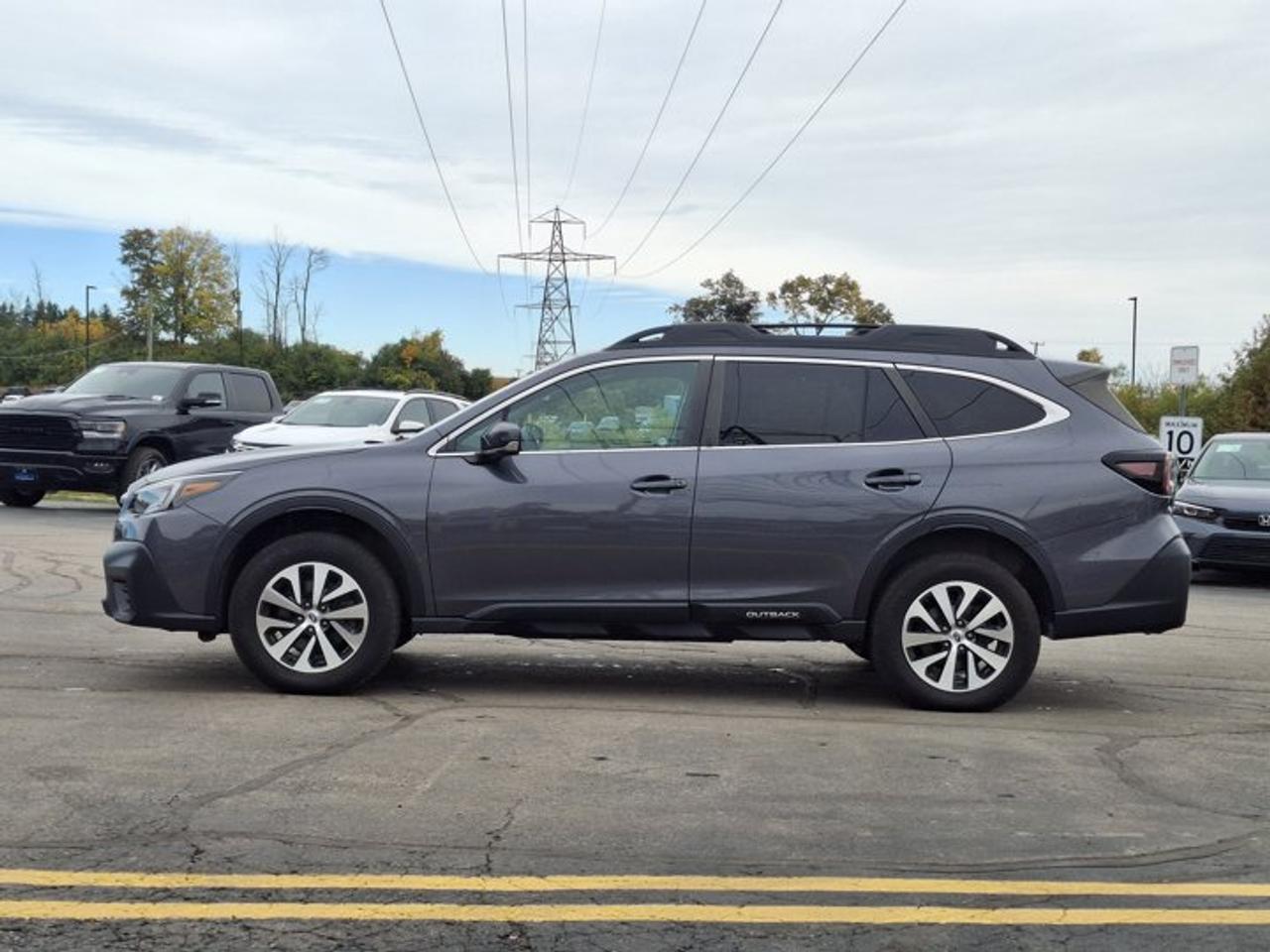 2022 Subaru Outback Touring AWD | Sunroof | Heated Seats + Steering | Power Liftgate | CarPlay + Android | and More ! Photo