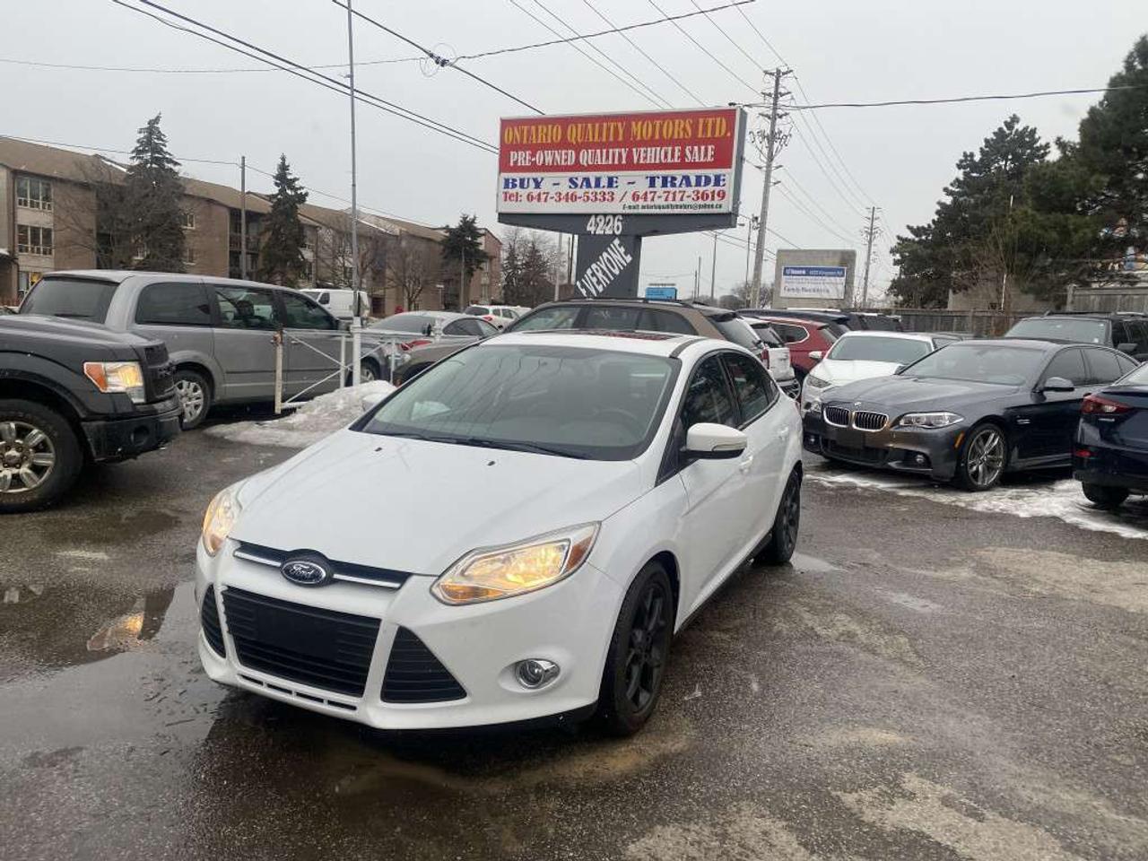 2013 Ford Focus 4dr Sdn Titanium Photo1