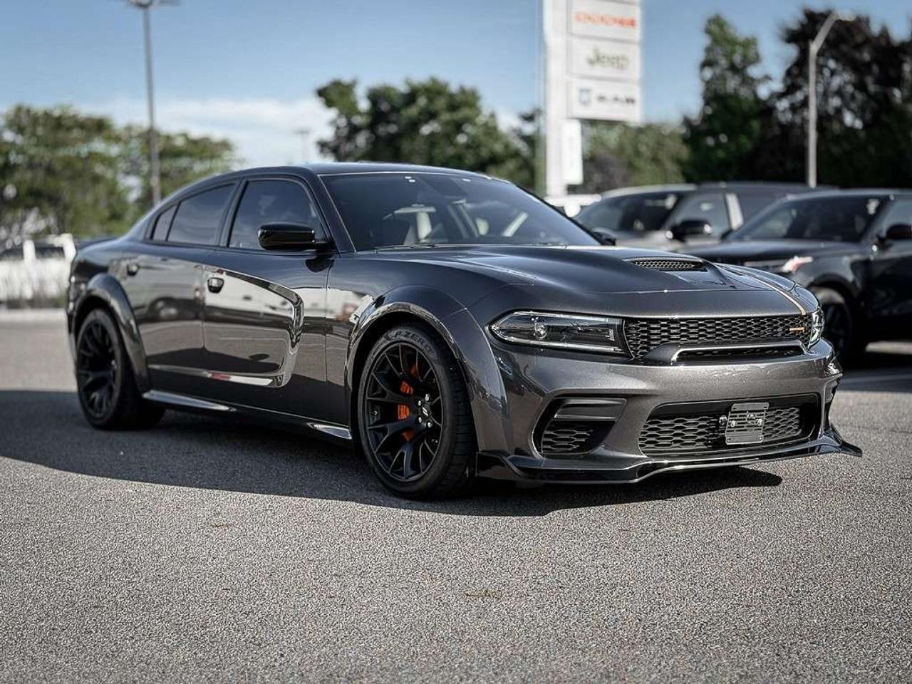 2023 Dodge Charger Scat Pack 392   WIDEBODY   HEMI ORANGE PKG   FRONT 3M   PLUS GROUP   CARBON AND SUEDE PKG   SUNROOF Photo