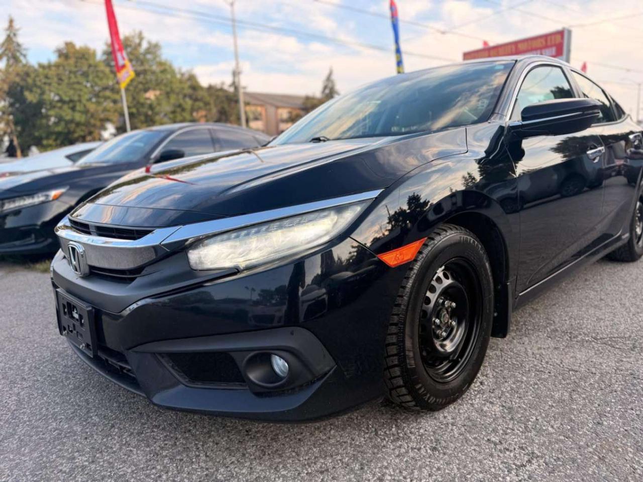 2017 Honda Civic 4dr CVT Touring Photo2