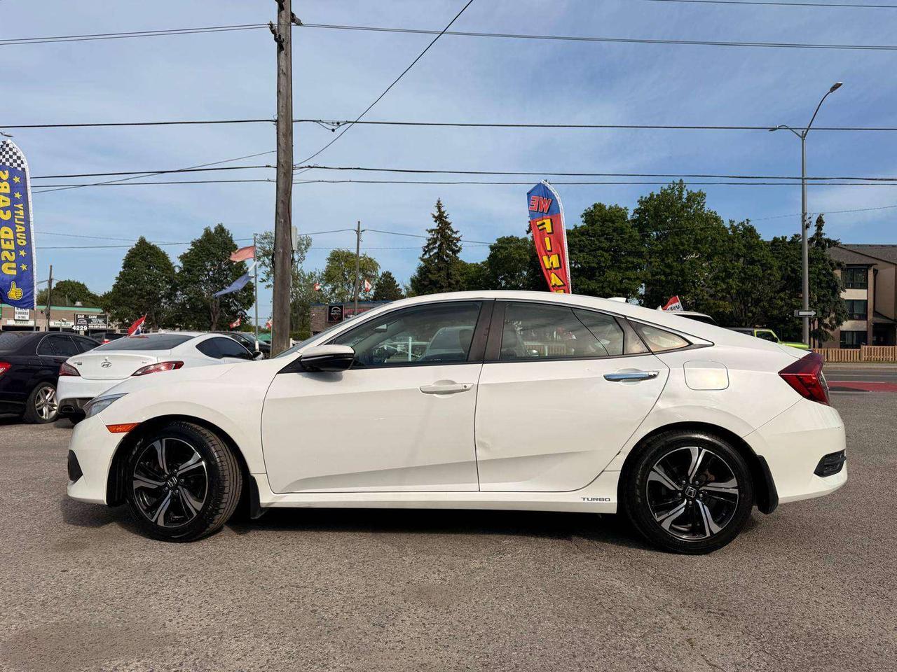 2017 Honda Civic 4dr CVT Touring Photo