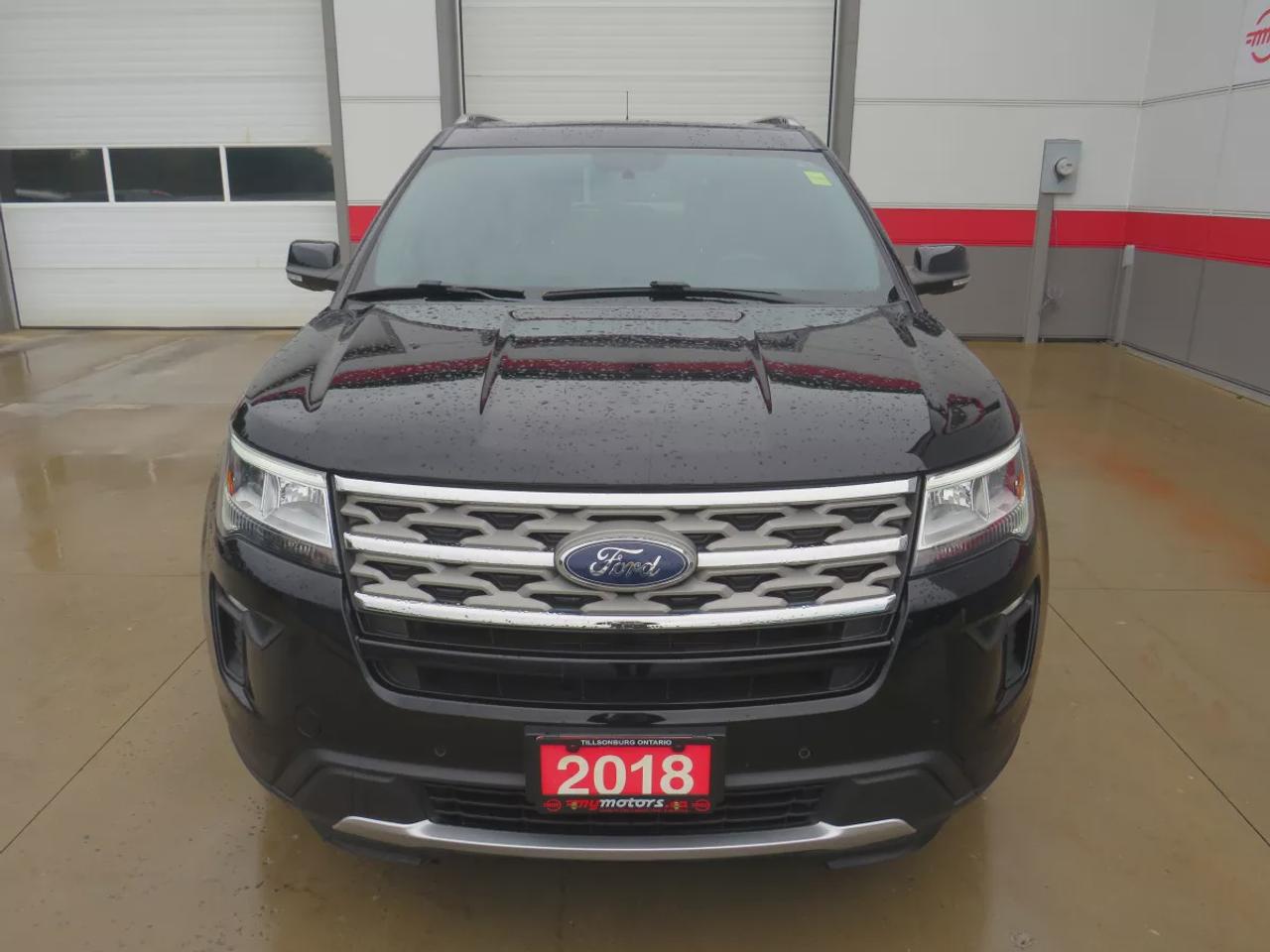 2018 Ford Explorer XLT | 4WD | Automatic | Alloy Wheels | Twin-Panel Moonroof | Power Liftgate | Dual-Zone Climate Control | Touchscreen | Navigation | Bluetooth | Back-Up Camera | Rear Park Assist | Remote Start | Cruise Control | Leather-Wrapped Steering Wheel | Garage Do Photo