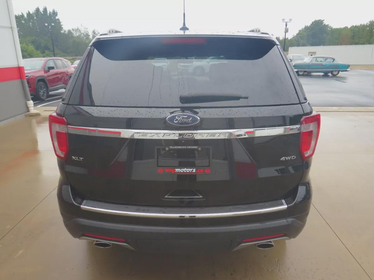 2018 Ford Explorer XLT | 4WD | Automatic | Alloy Wheels | Twin-Panel Moonroof | Power Liftgate | Dual-Zone Climate Control | Touchscreen | Navigation | Bluetooth | Back-Up Camera | Rear Park Assist | Remote Start | Cruise Control | Leather-Wrapped Steering Wheel | Garage Do Photo
