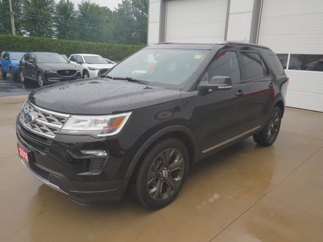 2018 Ford Explorer XLT | 4WD | Automatic | Alloy Wheels | Twin-Panel Moonroof | Power Liftgate | Dual-Zone Climate Control | Touchscreen | Navigation | Bluetooth | Back-Up Camera | Rear Park Assist | Remote Start | Cruise Control | Leather-Wrapped Steering Wheel | Garage Do Photo