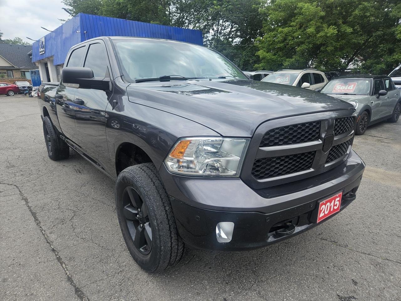 2015 RAM 1500 4WD CREW CAB 149" OUTDOORSMAN - Photo #1