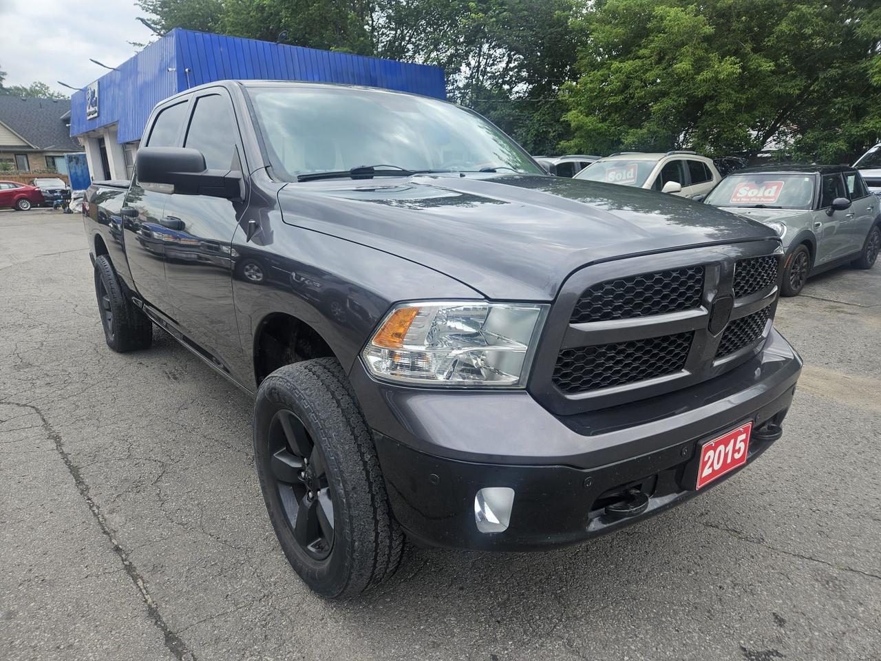 2015 RAM 1500 4WD CREW CAB 149" OUTDOORSMAN - Photo #1