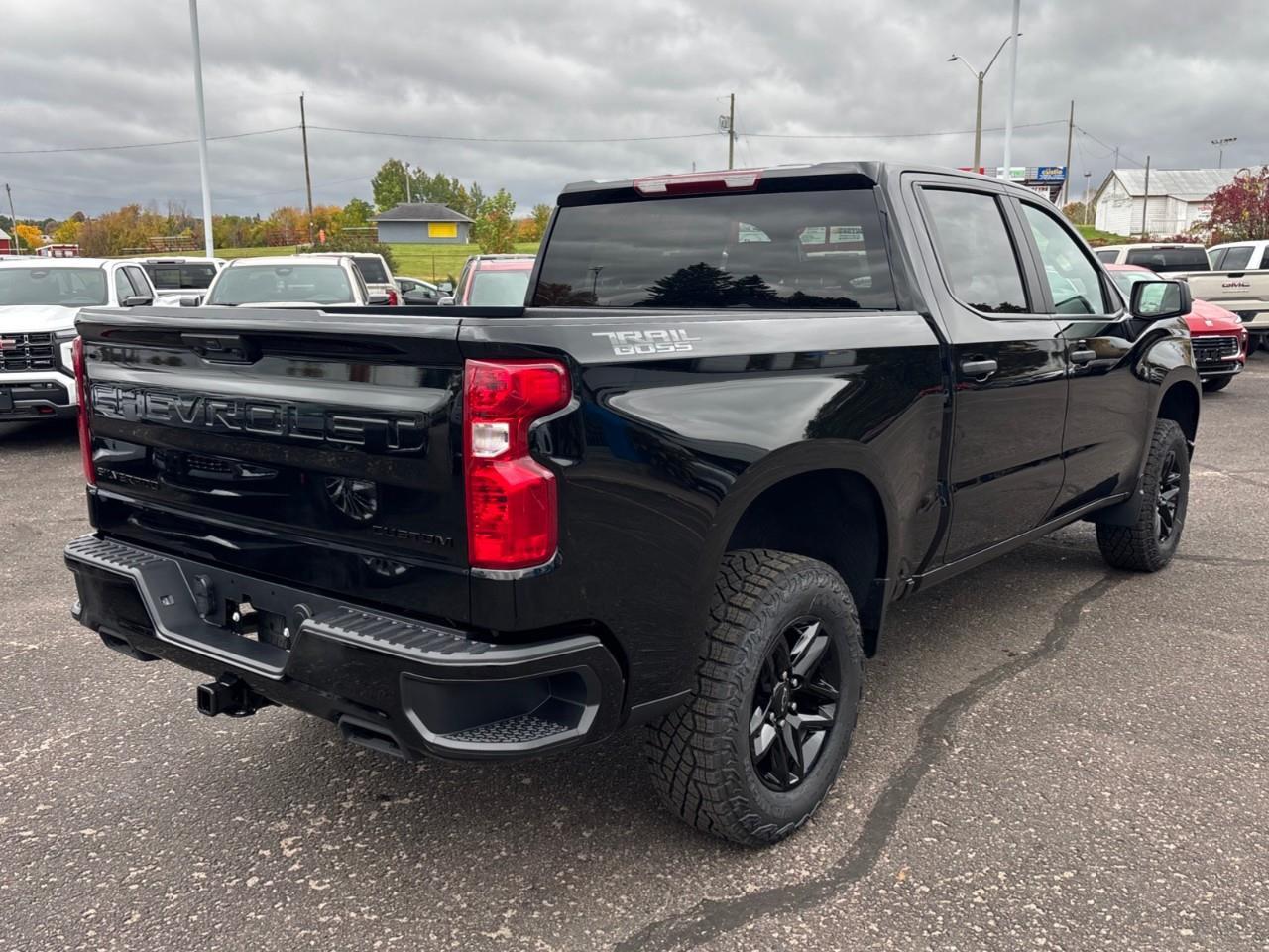 2026 Chevrolet Silverado 1500 Custom Trail Boss New 2026 Gas Powered V8 6 Passenger Crew Cab 4X4 Truck with a 2 Factory Installed Lift, Push Button Start with Remote Vehicle Start and a 7 Diagonal Touchscreen Radio with Wireless Apple CarPlay and W Photo