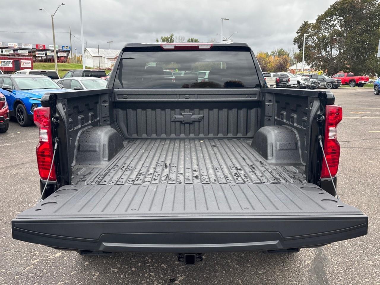 2026 Chevrolet Silverado 1500 Custom Trail Boss New 2026 Gas Powered V8 6 Passenger Crew Cab 4X4 Truck with a 2 Factory Installed Lift, Push Button Start with Remote Vehicle Start and a 7 Diagonal Touchscreen Radio with Wireless Apple CarPlay and W Photo