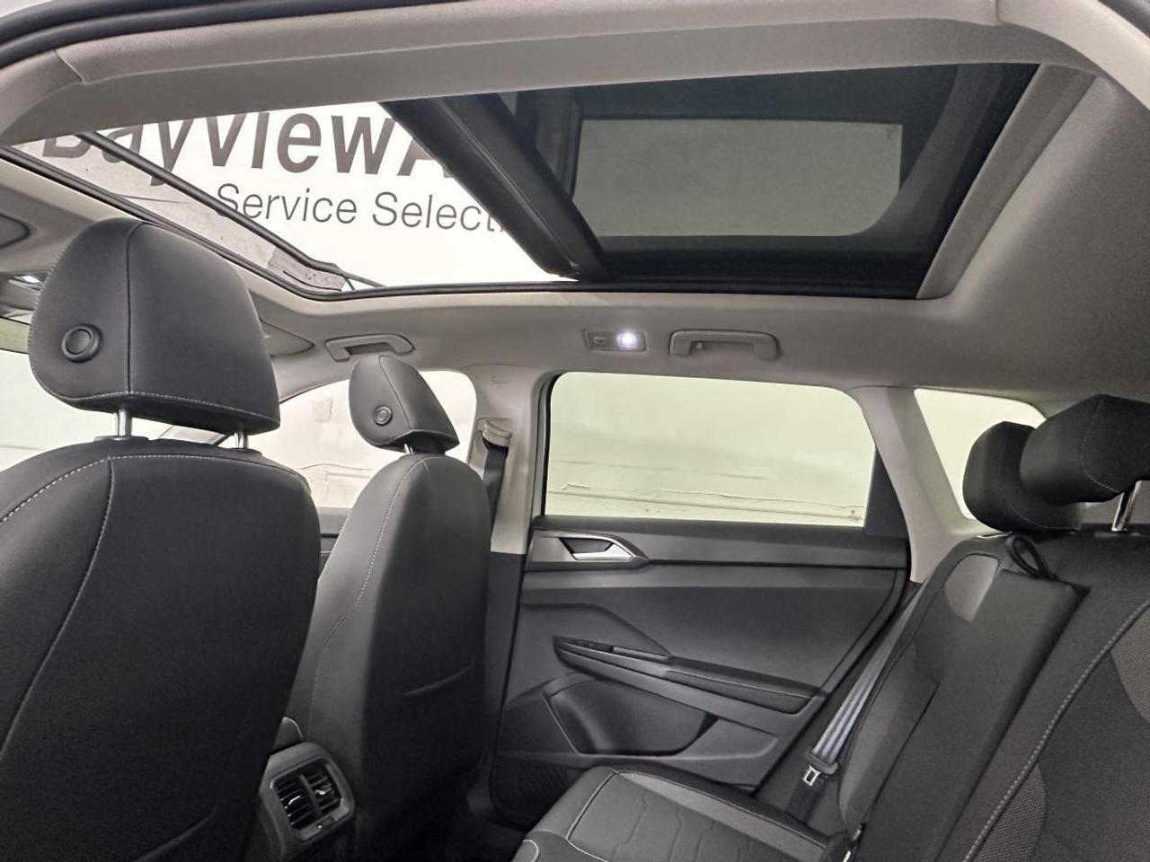 2025 Volkswagen Taos Comfortline Black Edition COMFORTLINE/AWD/BLACK EDITION/PANOROOF/LEATHER/6400KM/VW DIRECT! Photo