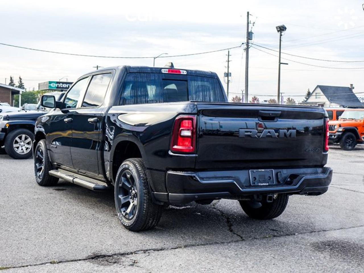 2026 RAM 1500 BLACK EXPRESS Crew Cab 5'7'' Box 3.6L Pentastar V6 eTorque | Black Express Edition | Customer Preferred Package 23D | 20-Inch Wheels Photo