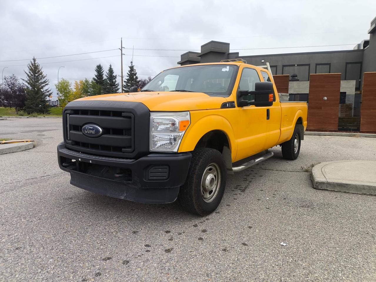 Yellow 2015 Ford F-250 Super Duty Pickup Truck Four-Wheel Drive Automatic